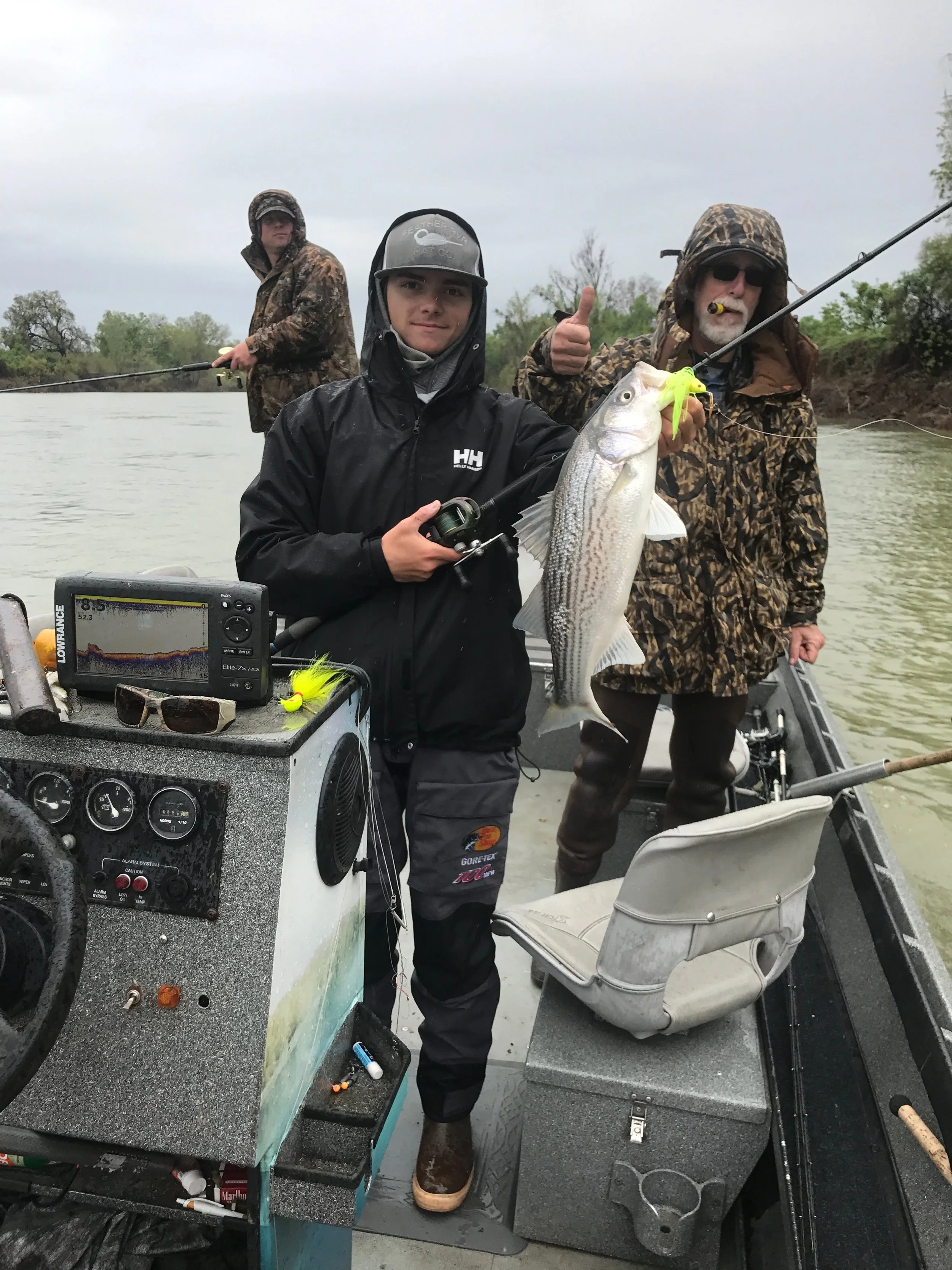 Deckhand Ryan Tripp with a quality striped bass he caught on the Feather River in Yuba City, Ca while fishing with SalmonSacRiver.com striped bass fishing guide Mike Rasmussen on April 8, 2017.