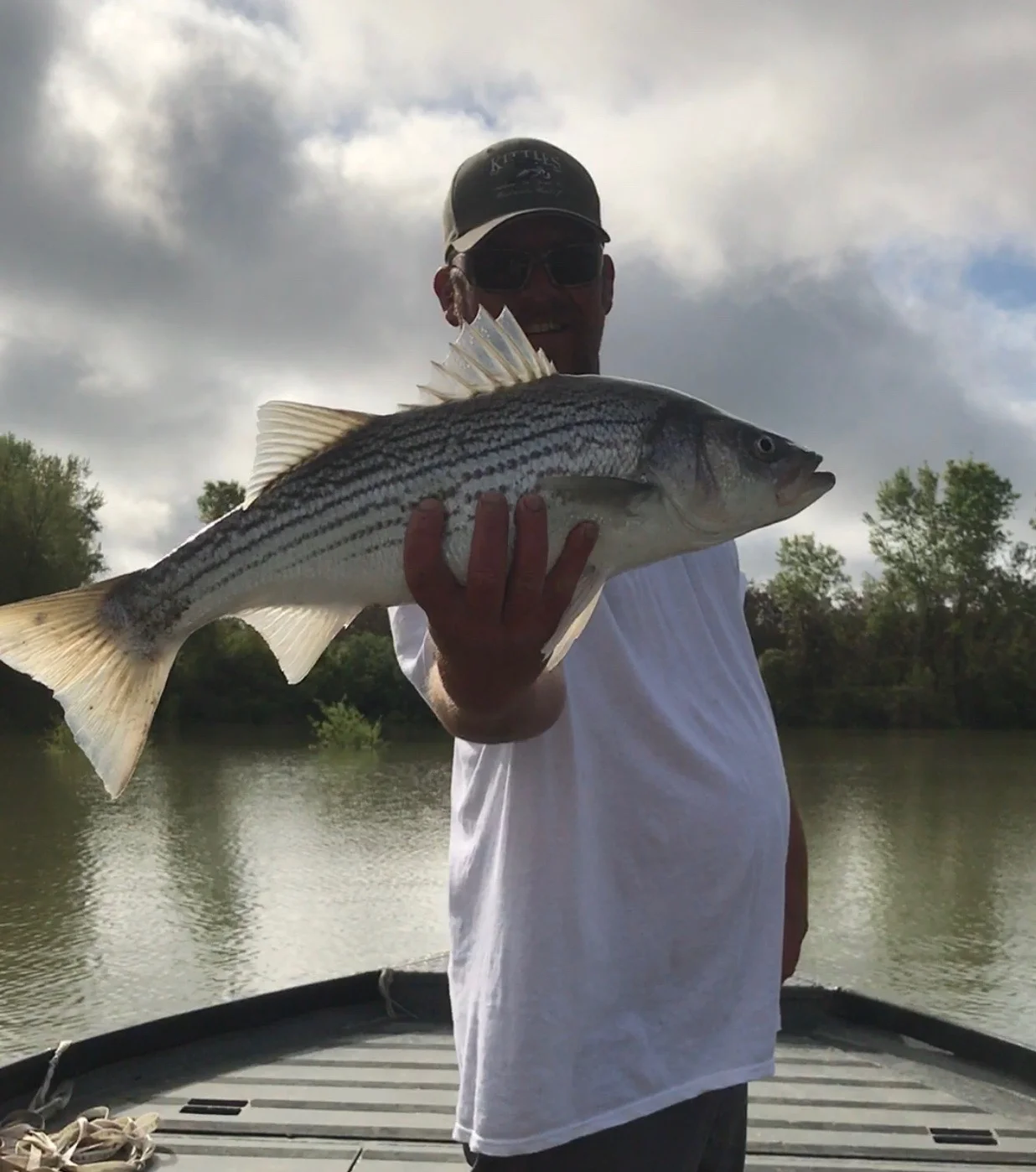 Striped Bass Fishing Guide Mike Rasmussen Holding A Keeper Striped Bass