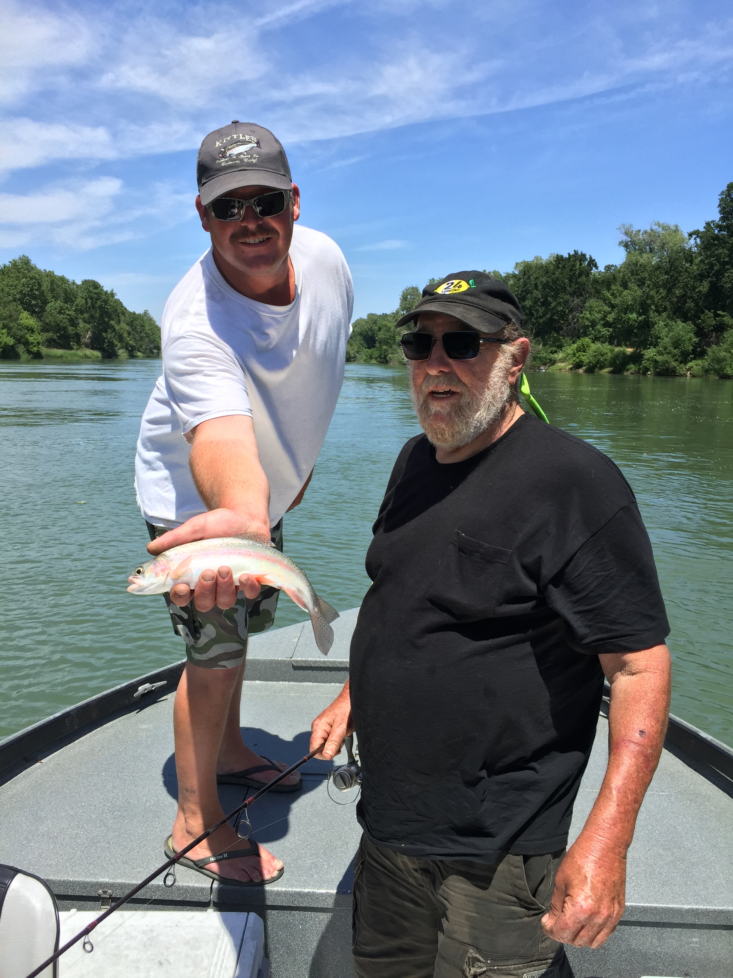 Mike Rasmussen took the opportunity to jump on board with Northern California fishing guide Billy Driessen of Driessen's Guide Service driessensguideservice.com and go for a drift or two with him and his clients for the day Tom and Jerry. Pictured is Tom, standing next to Mike Rasmussen who is holding a Sacramento River Rainbow Trout that Tom caught drifting a cricket under a sliding bobber near Red Bluff, Ca on June 6, 2017. Photo Credits to Billy Driessen.