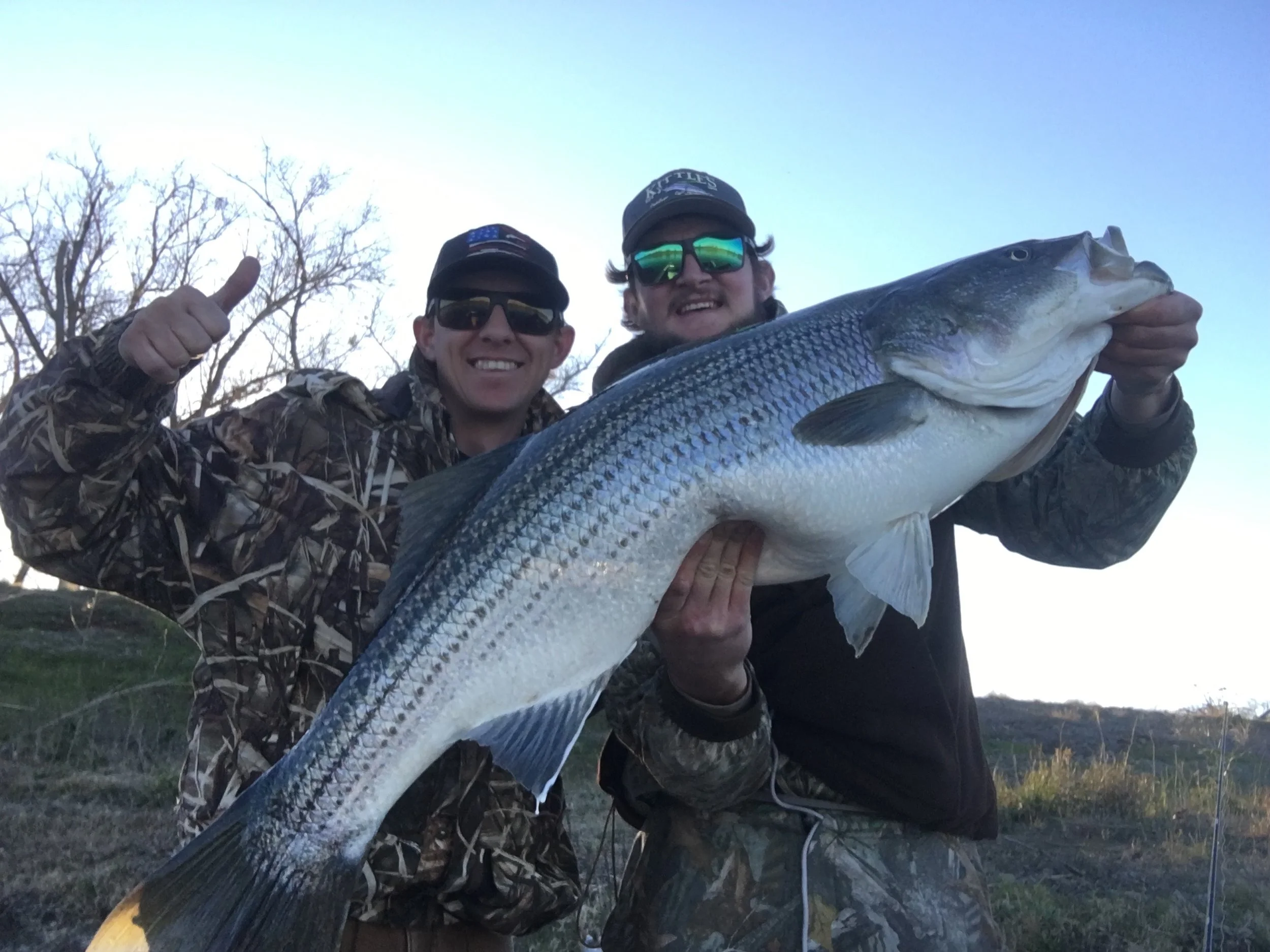 Cole Barnes and his fishing partner and friend Logan Jennings hold up a big sow striped bass for a quick picture before releasing the big girl back into the Sacramento River on Sunday March 4, 2018.