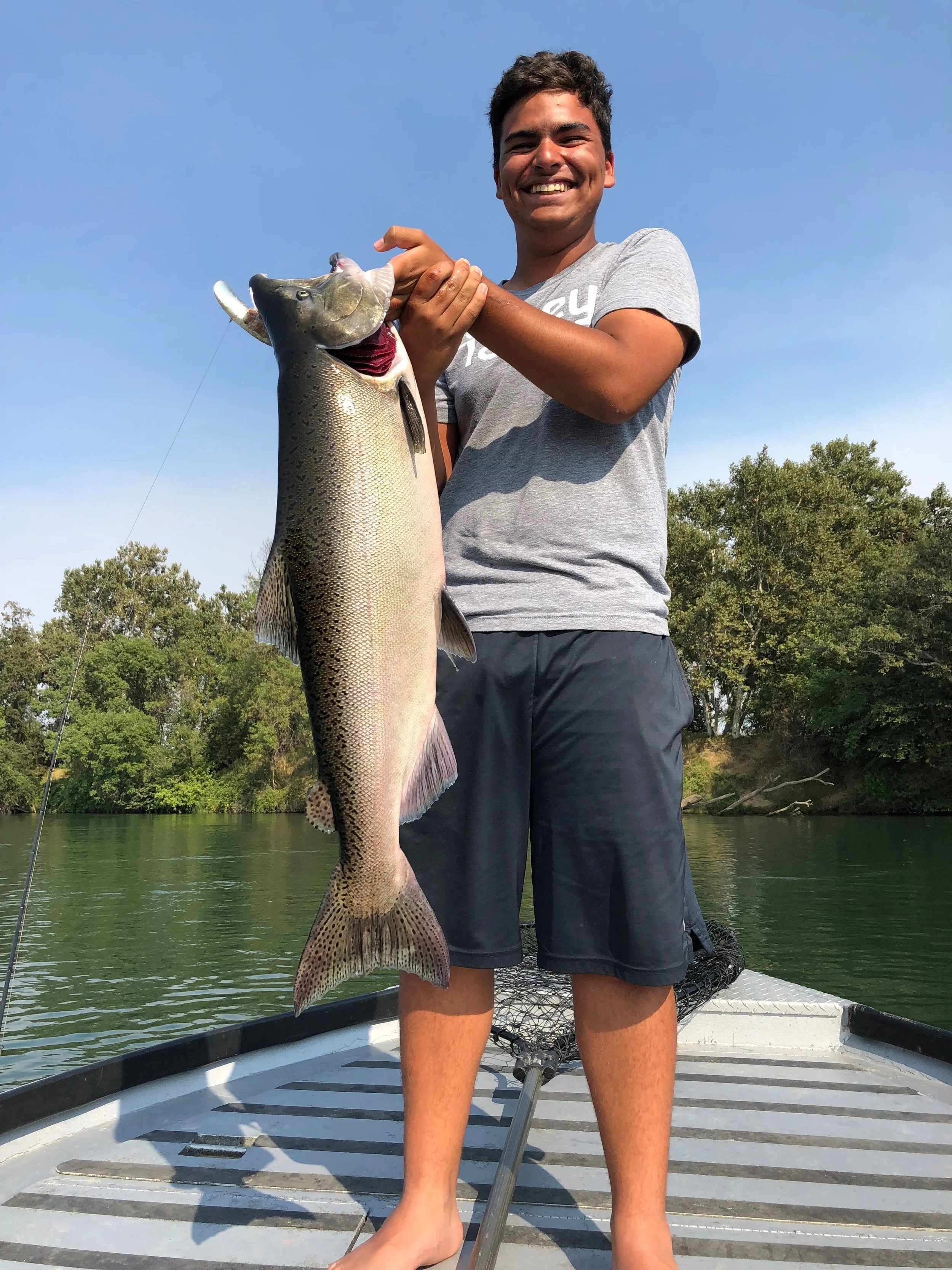 Client RJ, holds a Sacramento River salmon he caught back bouncing a T-55 Flatfish while fishing with salmon fishing guide Mike Rasmussen near Red Bluff, Ca last week.