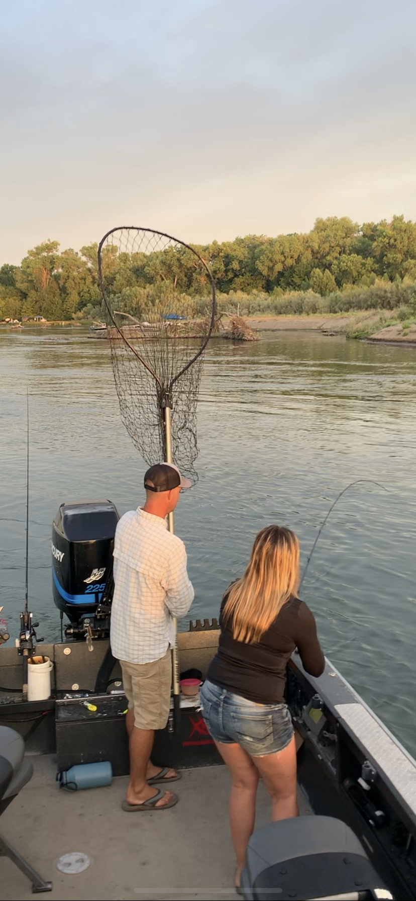 John Pearl of J. Pearl Guide Service holds the net. Preparing to net the chrome Chinook Salmon Amanda Gradney hooked while back bouncing a sardine wrapped Kwikfish on opening morning. July 16, 2019. Photo taken by salmon fishing guide Mike Rasmussen.