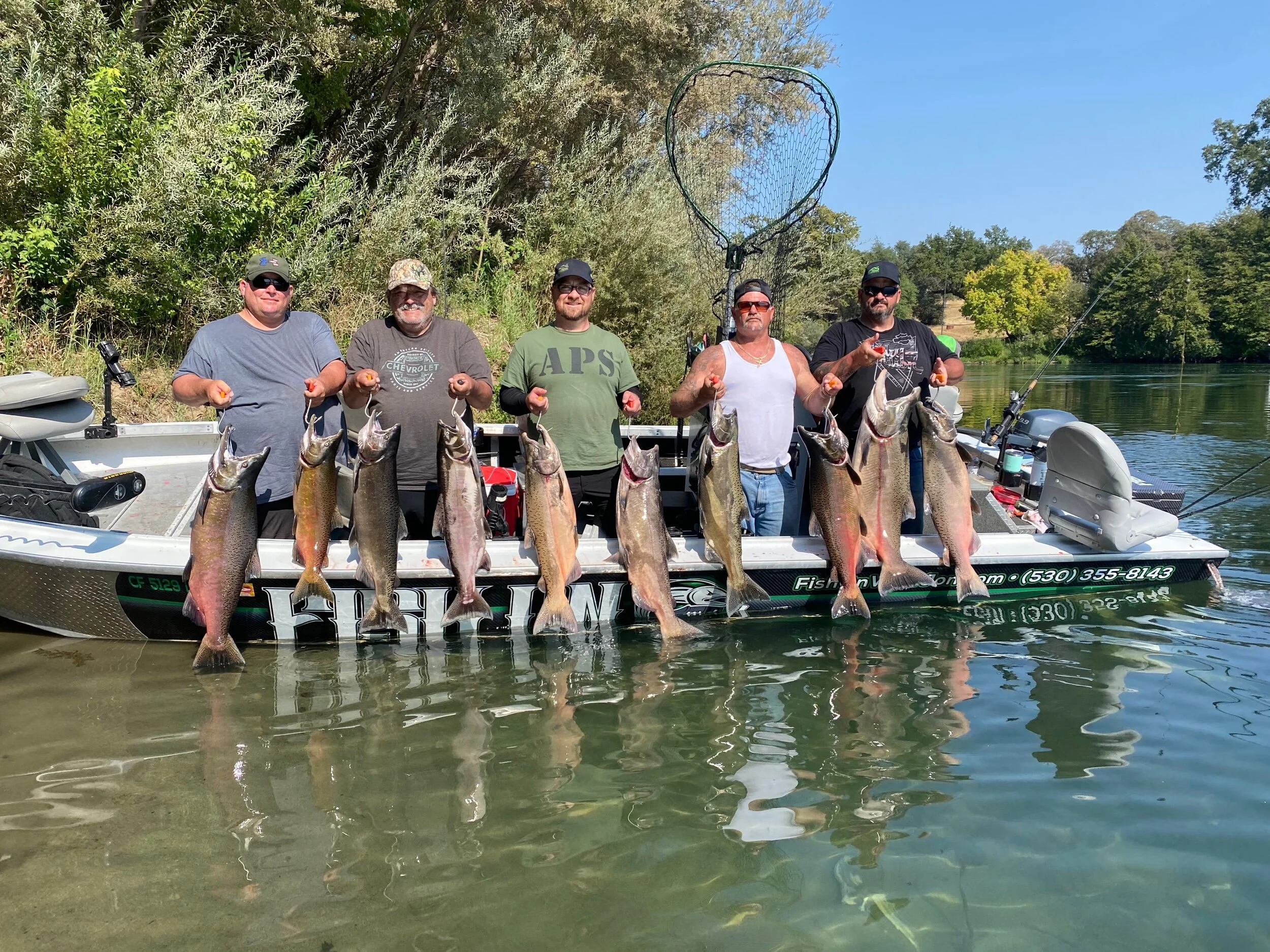 Happy guests of fishing guide John Kenyon hold up their days catch after fishing the famous “barge hole”. Expect salmon fishing to remain excellent through the month of October.