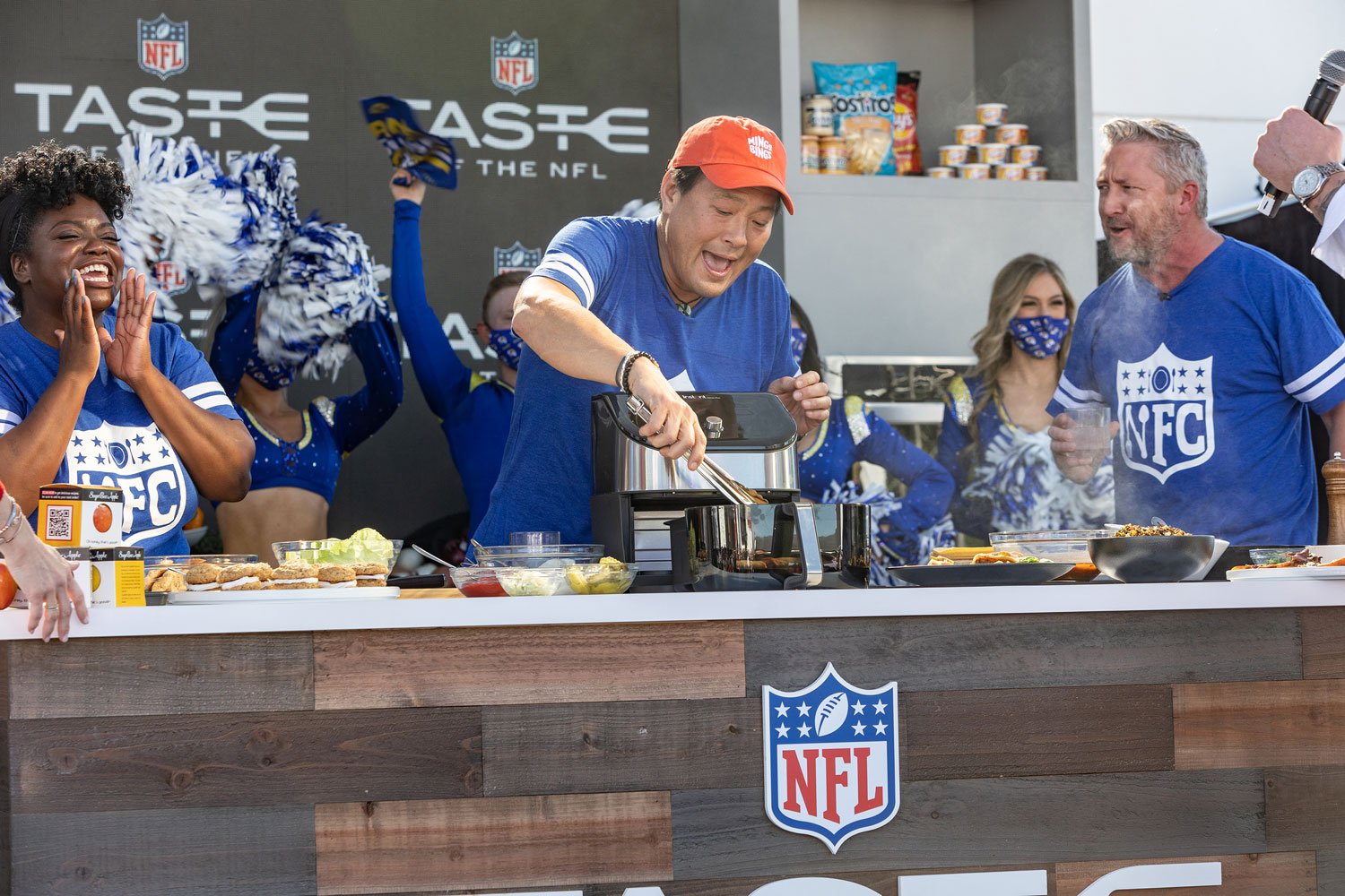 Taste-of-the-NFL-2022-Chefs-Competing-Cheering.jpg