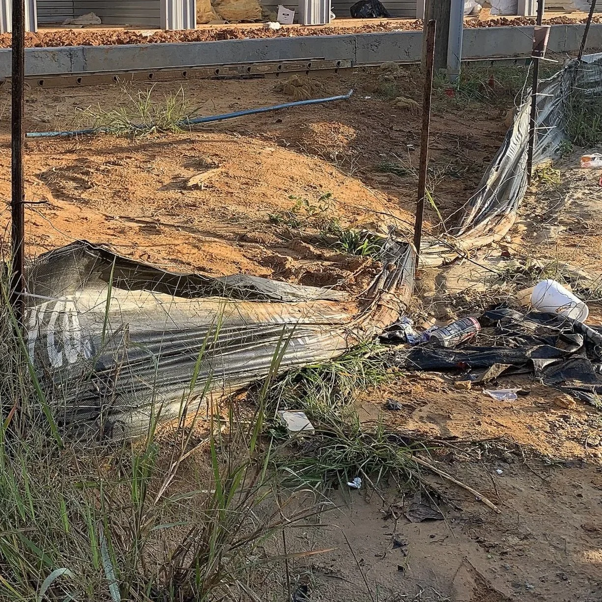 Damaged silt fence &amp; labor trash