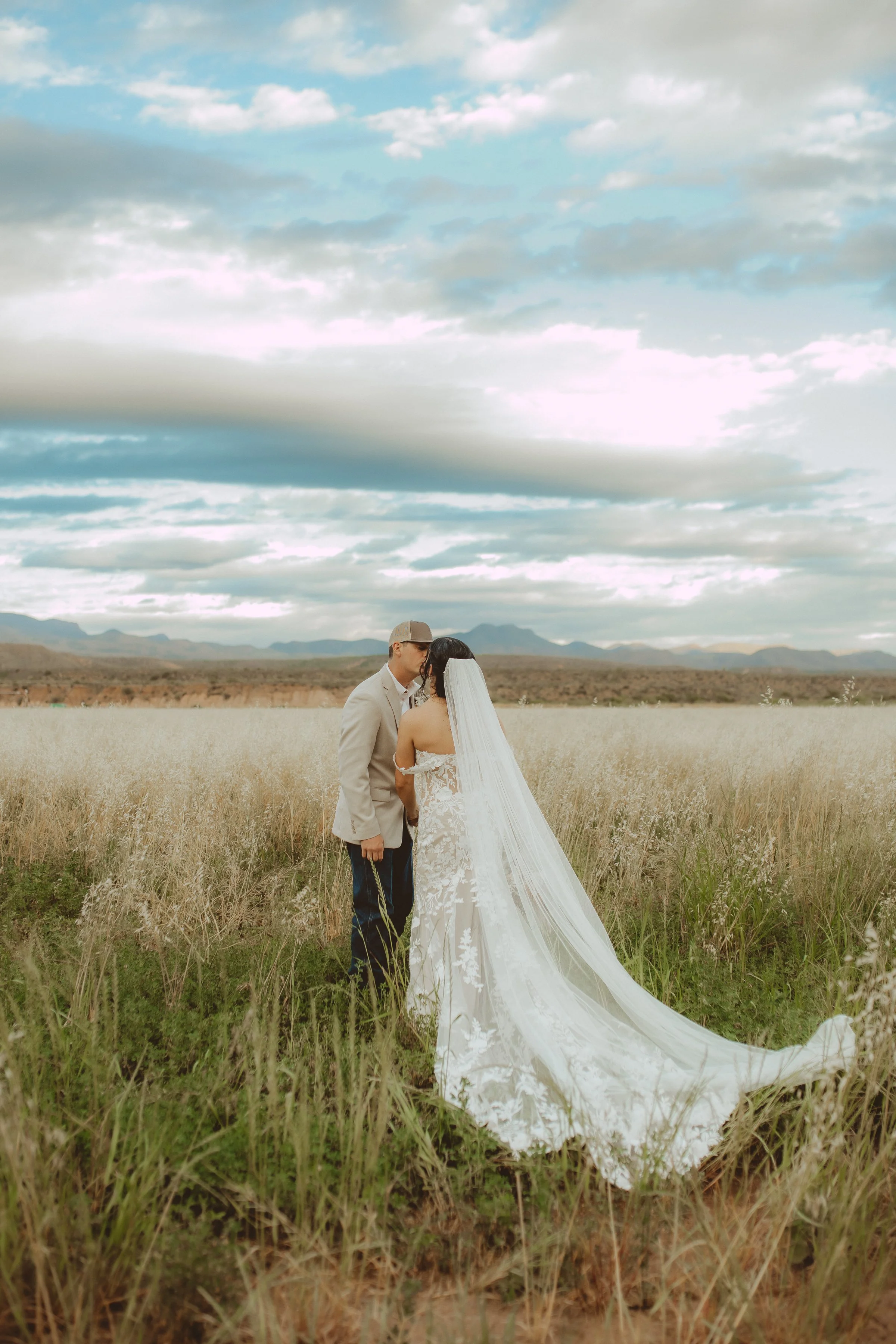 bride and groom kissing wedding day