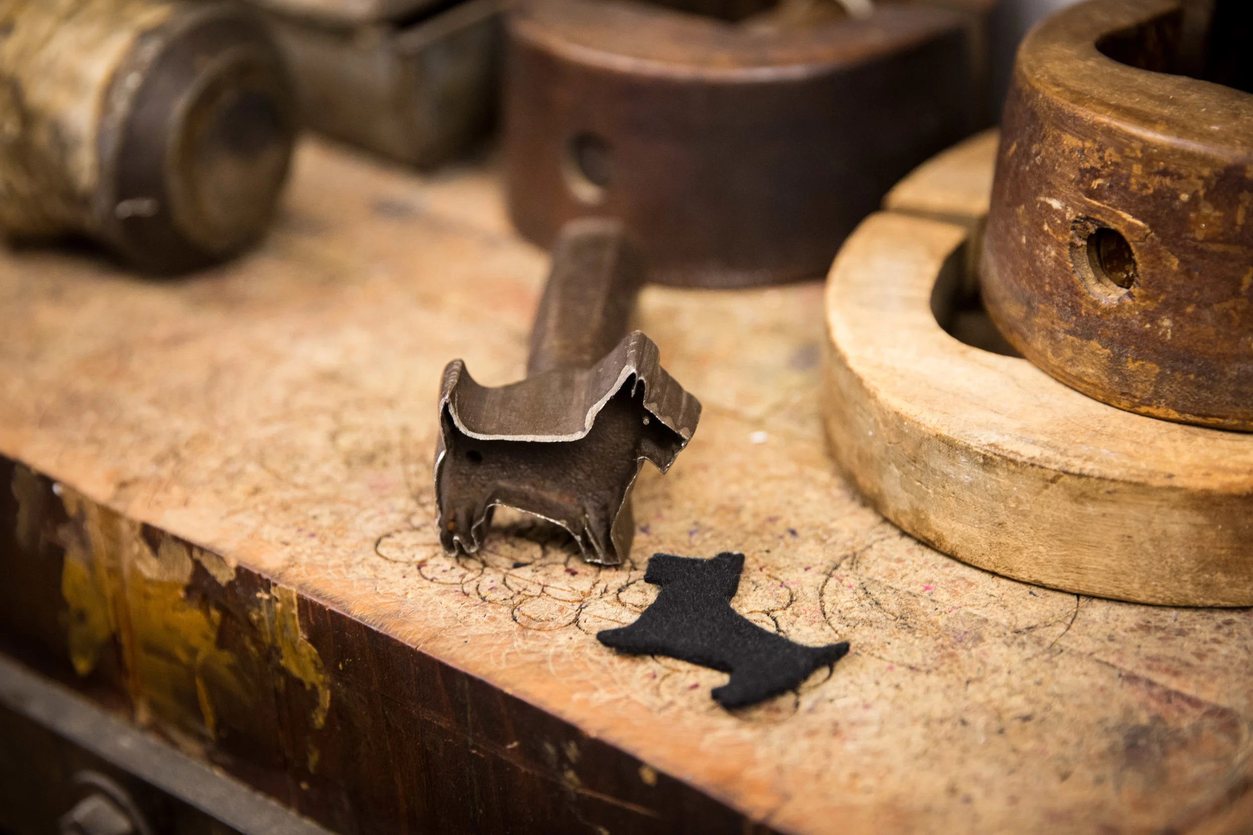  A 100 year old cast iron millinery fabric mold in a shape of a dog. Jennifer Ouellette has a large collections of molds in which she still uses for her hats. (Benjamin Chasteen/The Epoch Times) 