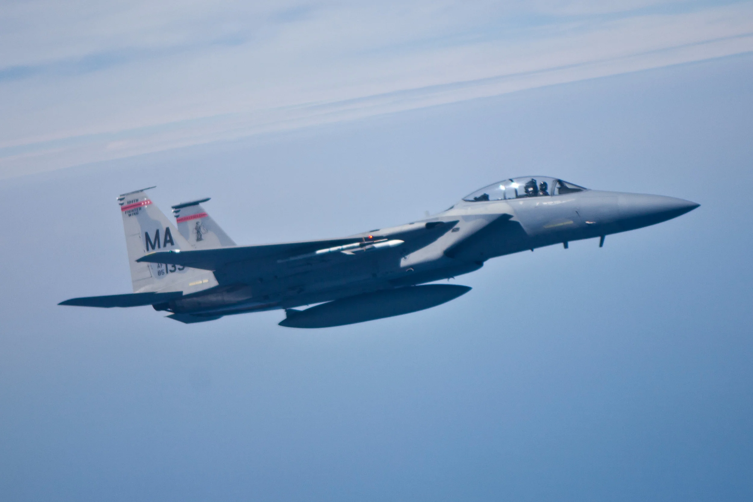  A F-15 C Eagle jet fighter is seen outside the window of the U.S. Air Force KC-10 Extender on Aug. 14, 2012 over the Atlantic Ocean. (Benjamin Chasteen/The Epoch Times) 