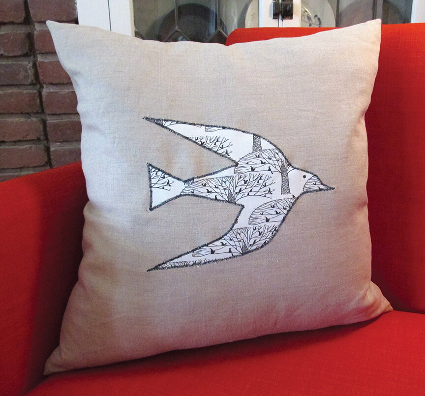 Stitched Birdware Pillow on Red Chair.With Eye.jpg