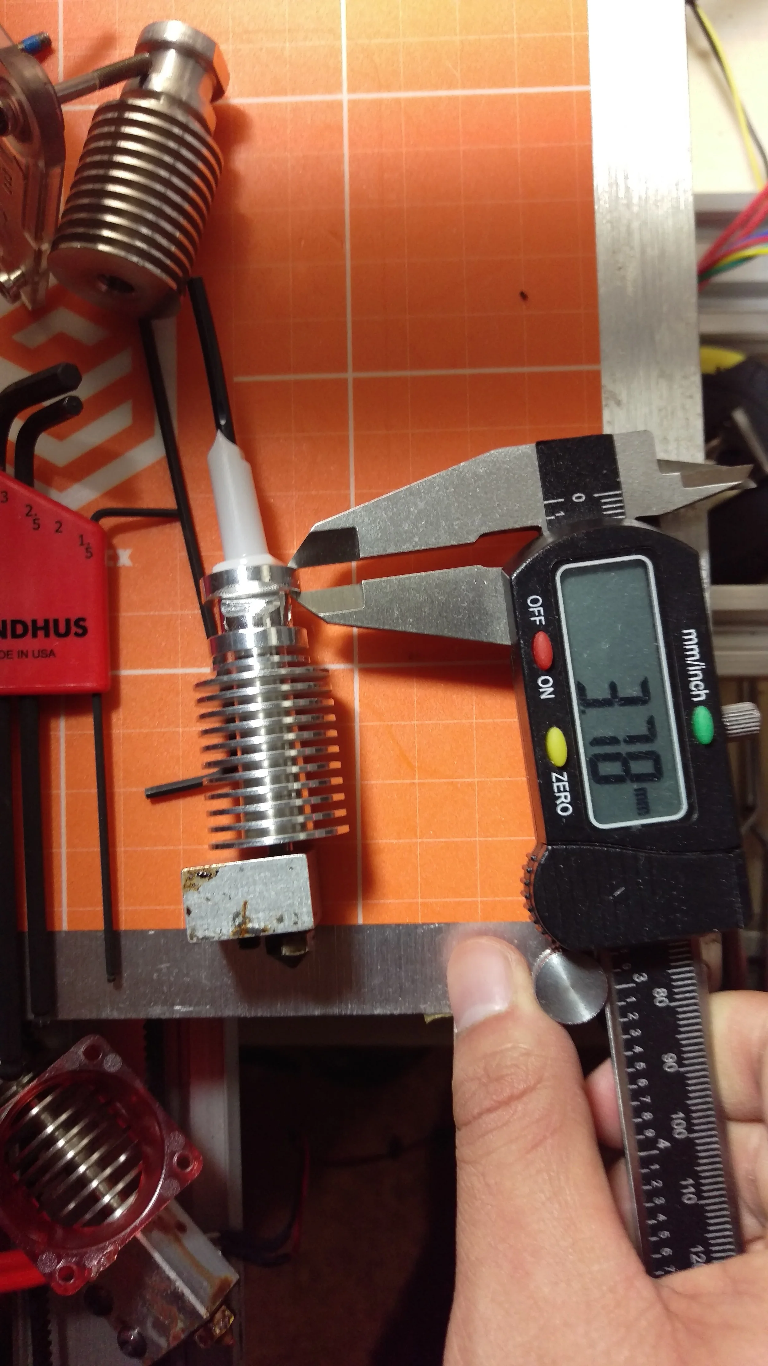 Spare #3. A small amount thicker at 3.78mm. Not so thick that it won't fit in the Titan, though.