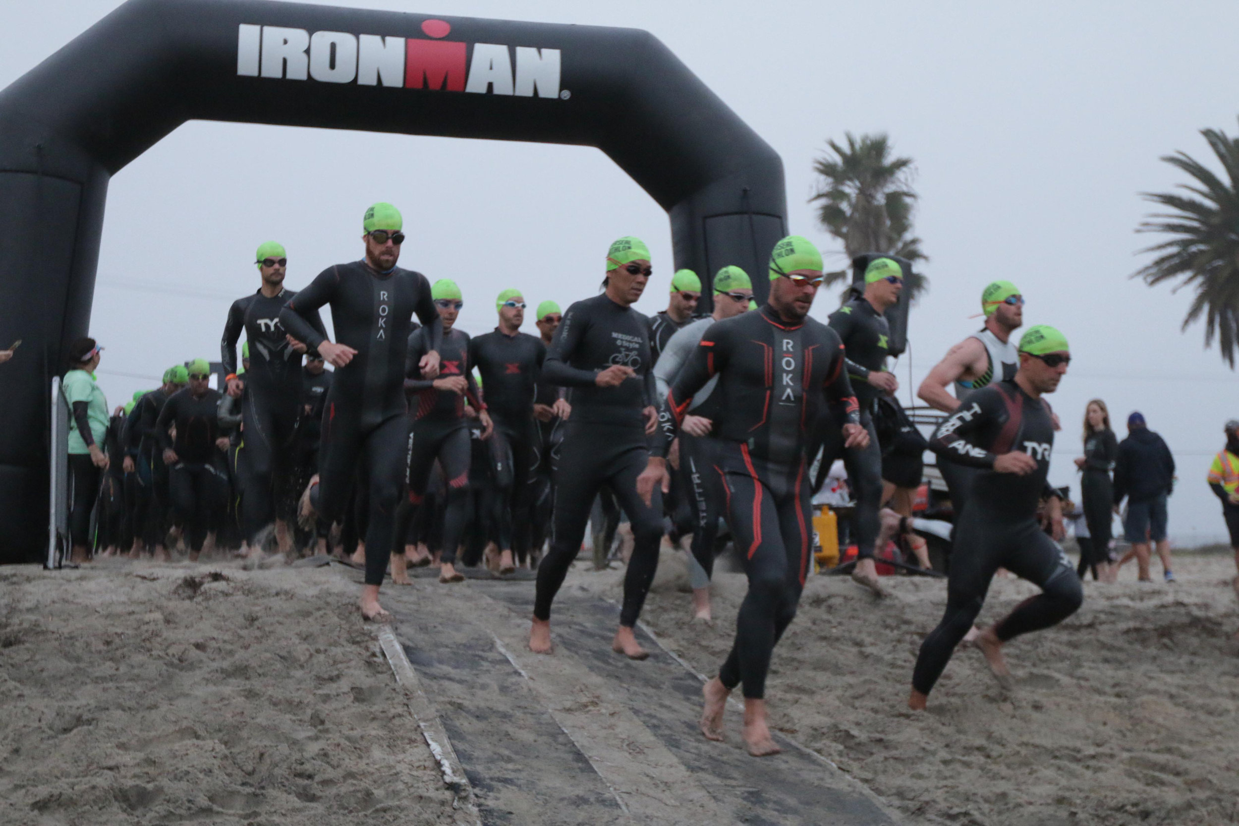 In my Hurricane TYR Wetsuit charging in to the water. At the start of the SuperSeal Olympic Distance with my Age Group.