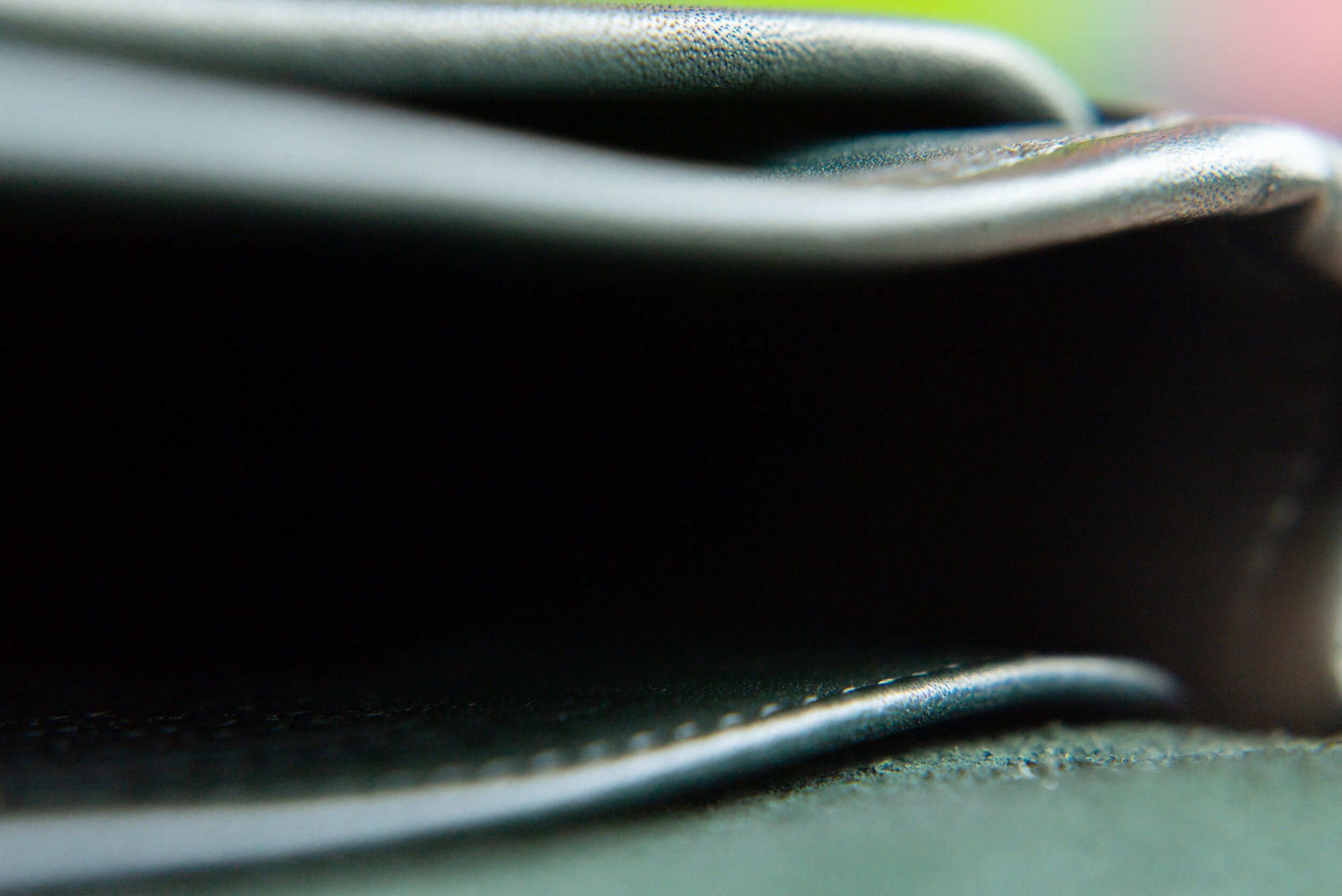 Three compartments. Outside pocket for cards, main pocket for small phone or snacks* lol and rear pocket behind Coach creed for notes or more cards