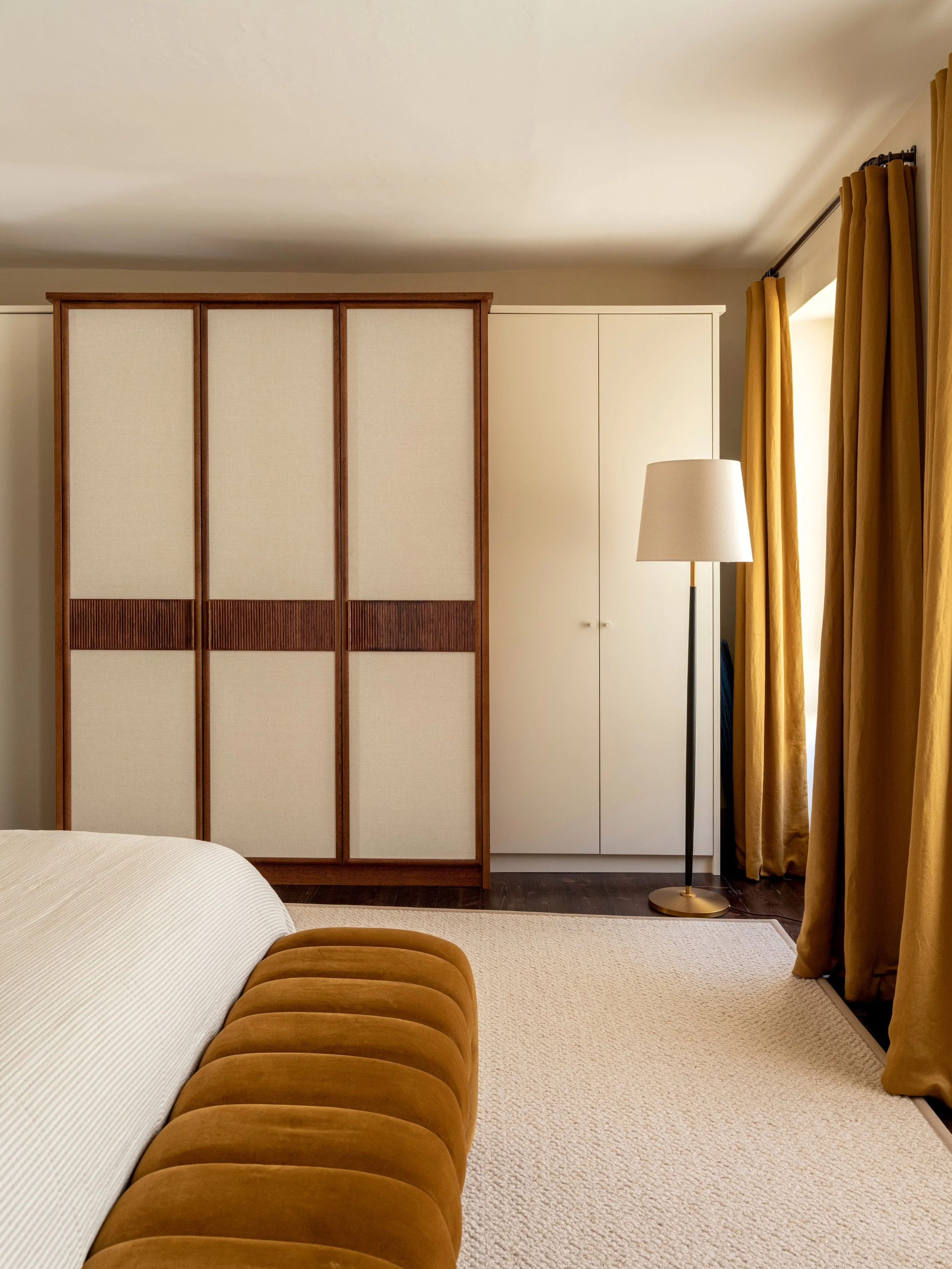 The master bedroom and bathroom in our Clifton project offered the opportunity to create bespoke joinery tailored to the petite dimensions of the rooms. The wardrobes have linen panels on the central doors and a reeded detail which is repeated on the
