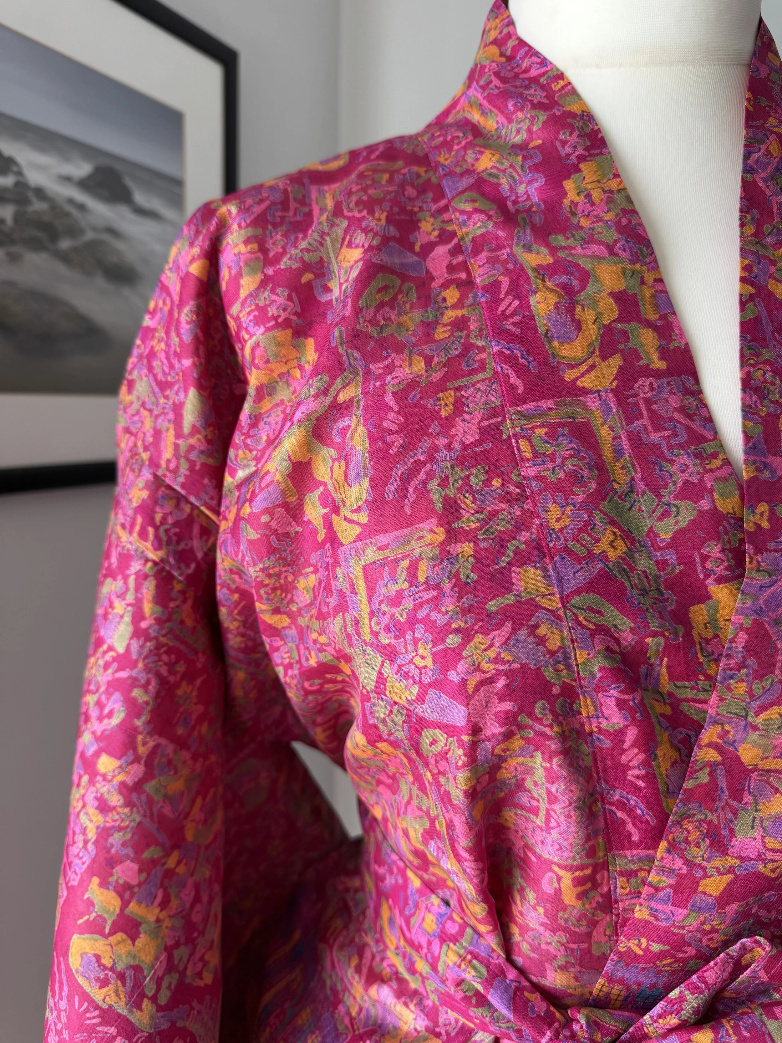 Close-up of kimono collar in Rani pink upcycled sari silk, traditional wrap-over design