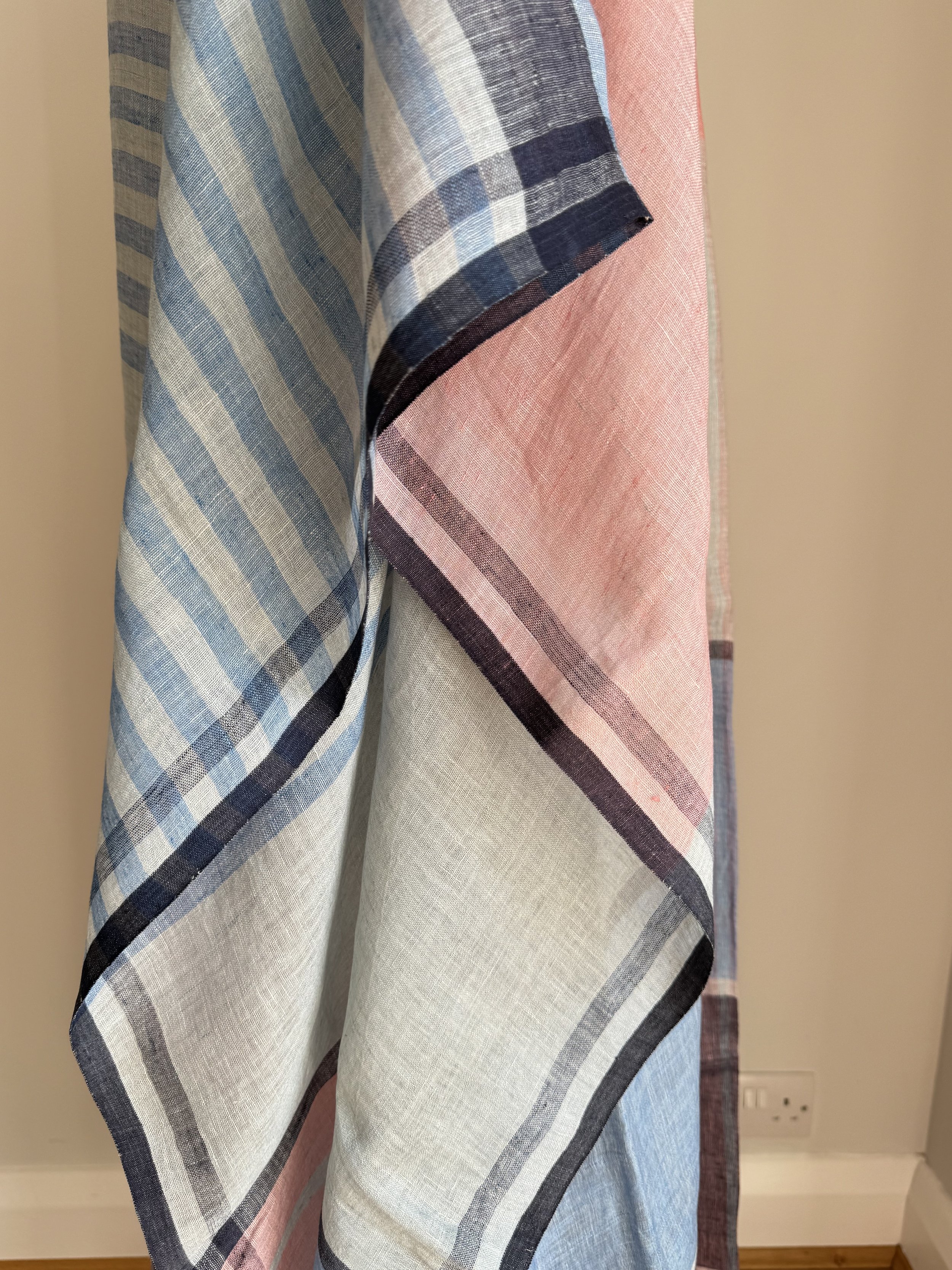 Close up of light blue stripes on sleeve of linen kaftan dress