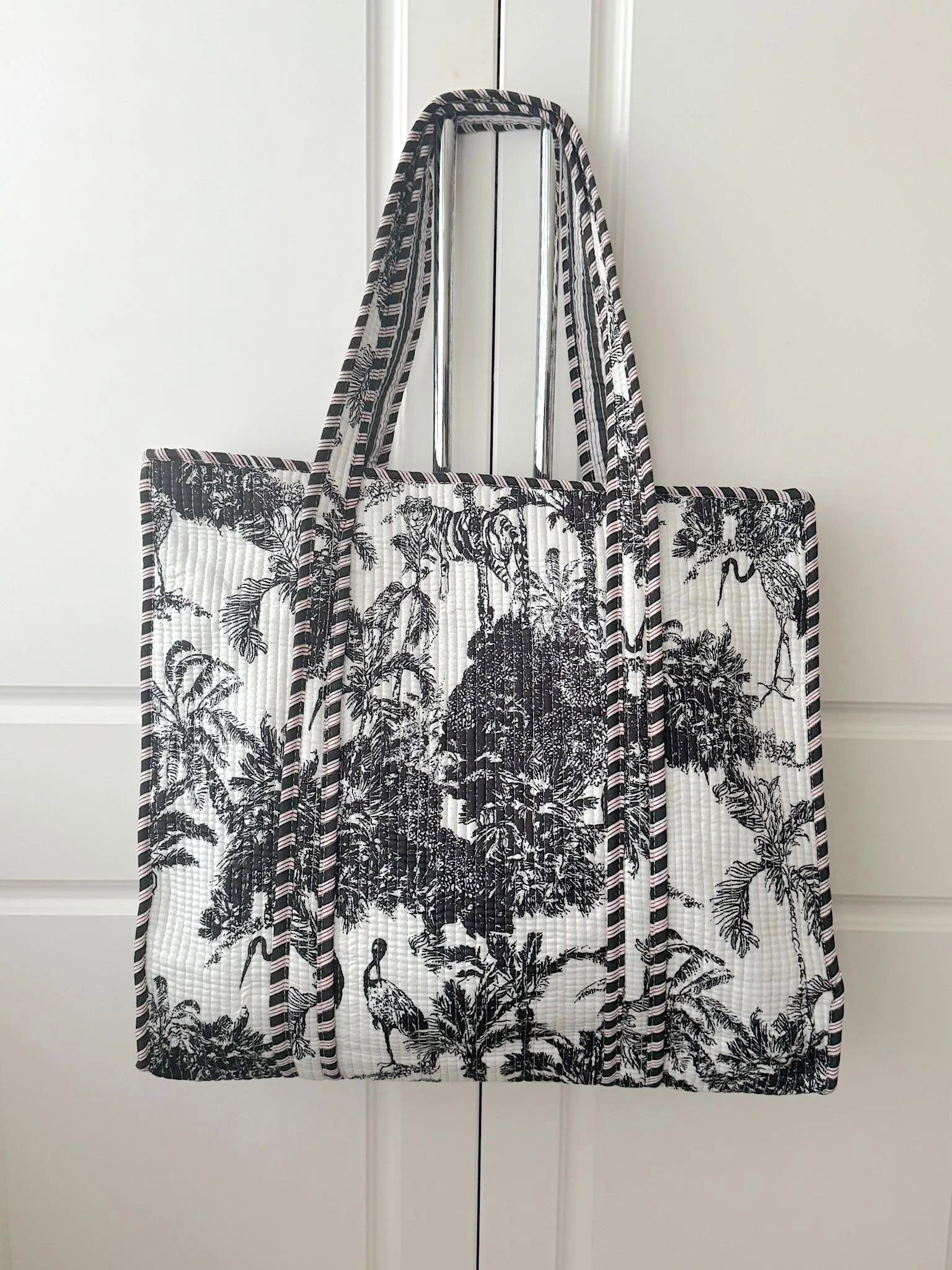 Handmade jungle Toile screen printed quilted cotton tote bag in black and white doile de jouy print with contrasting diagonal striped trims by Jewelled Buddha
