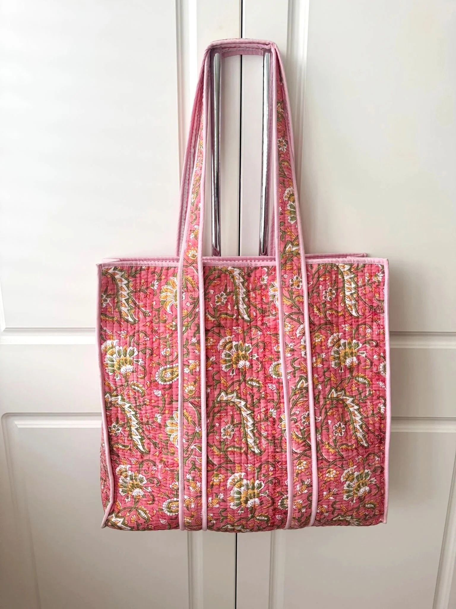 Colourful handmade pink hand block printed quilted tote bag with floral print in yellow, green and white