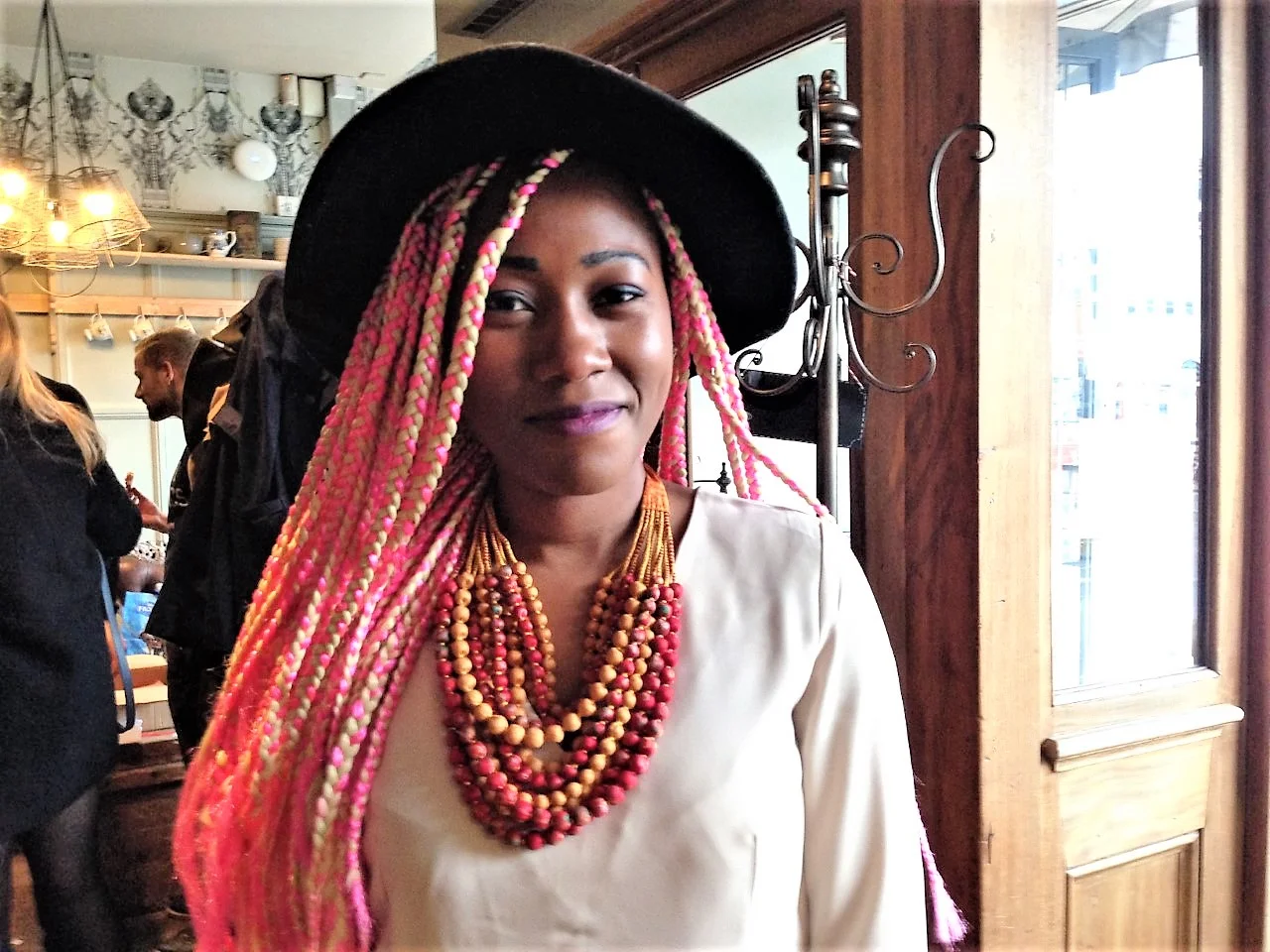 Nancy wears our 12 string necklace in Autumnal Yellow/Orange