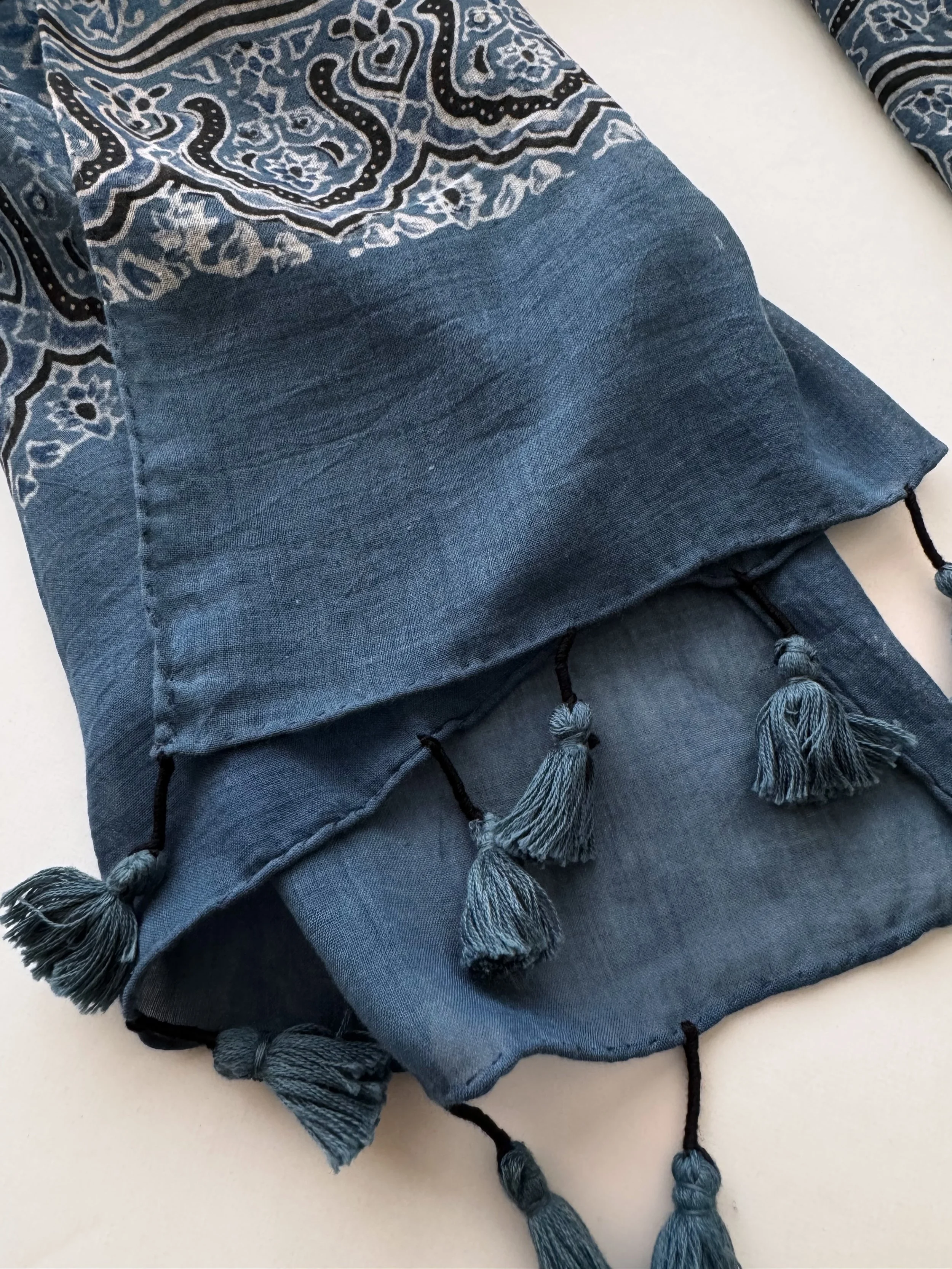 Indigo blue cotton scarf with tassel detail and block printed using the ancient art of Ajrakh