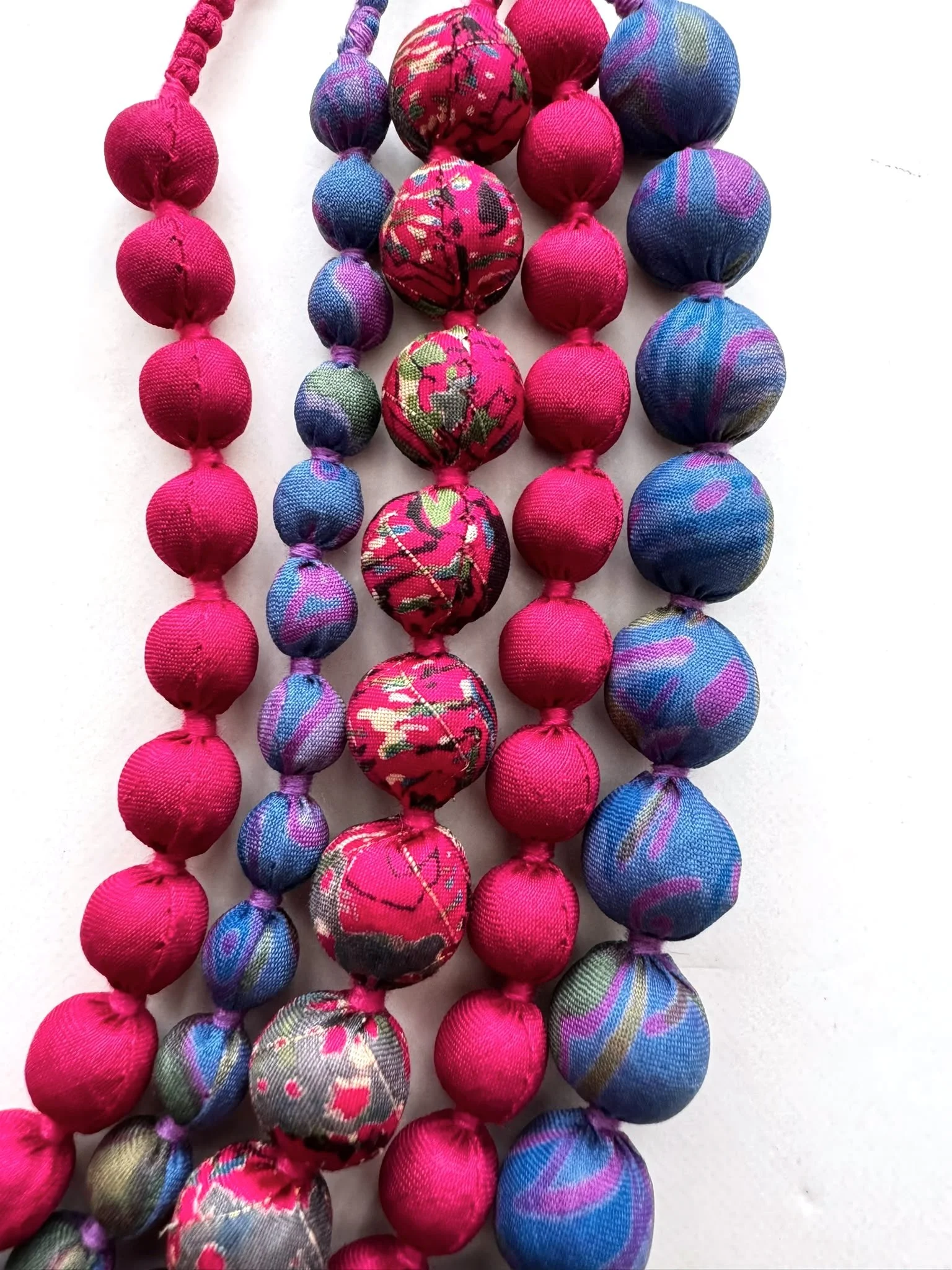 Close up of colourful beads on a sari silk beaded necklace