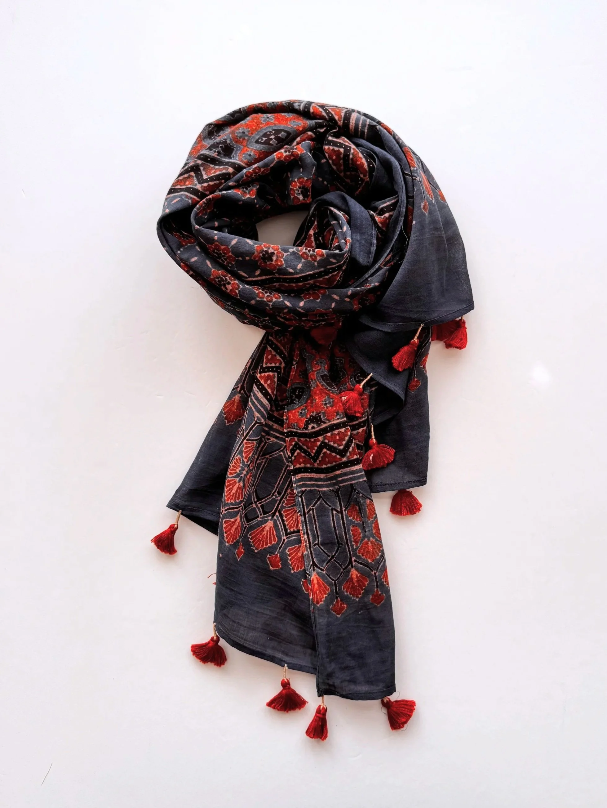 Handmade Ajrakh print soft cotton scarf wrapped in loose folds on a white background