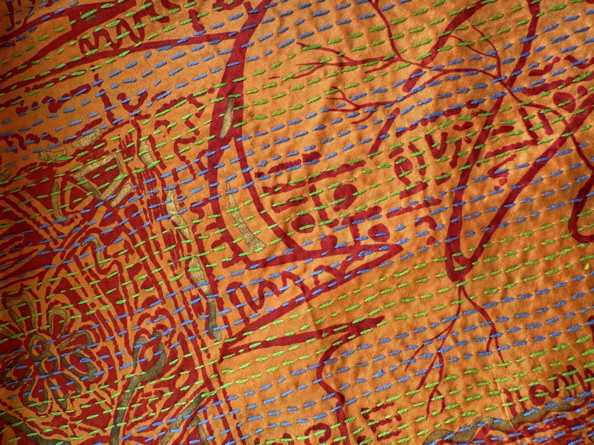 Orange upcycled kantha scarf with abstract and floral pattern in red with colourful kantha quilting