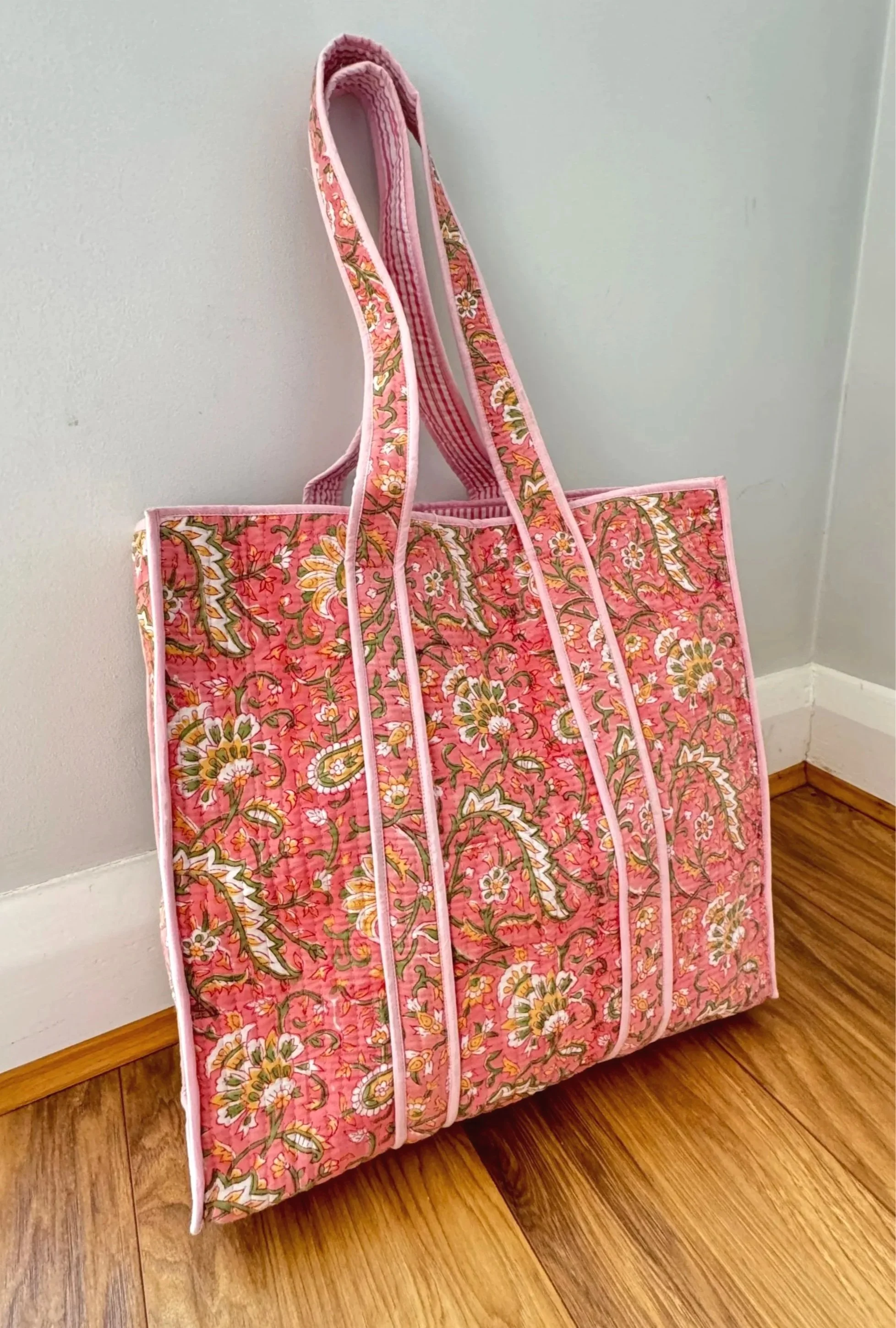Large handmade pink block printed tote shopper with traditional Indian hand block print floral design, with shoulder straps and contrasting trims.
