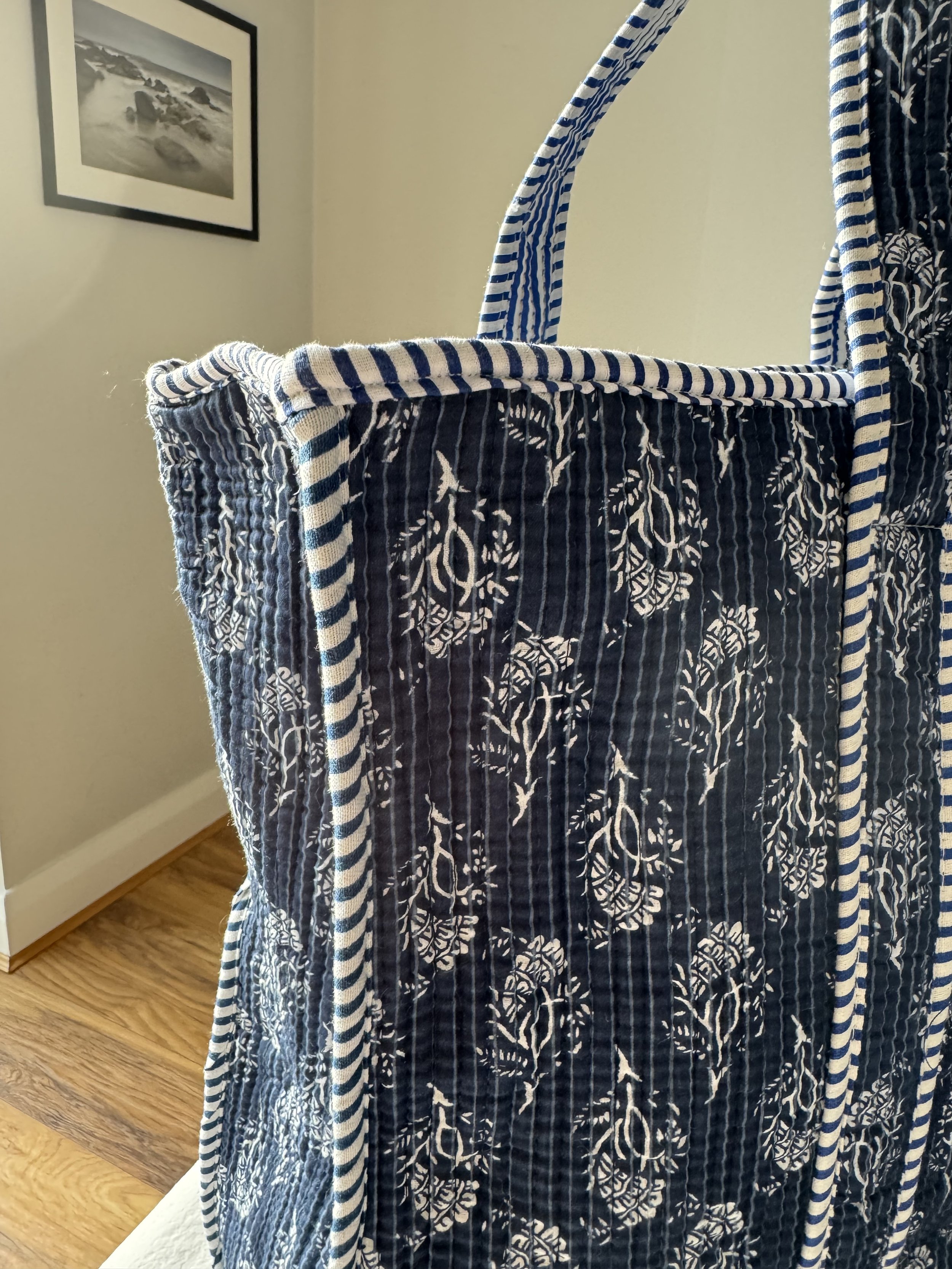 Detailed view of screen printed blue botanical print cotton tote bag
