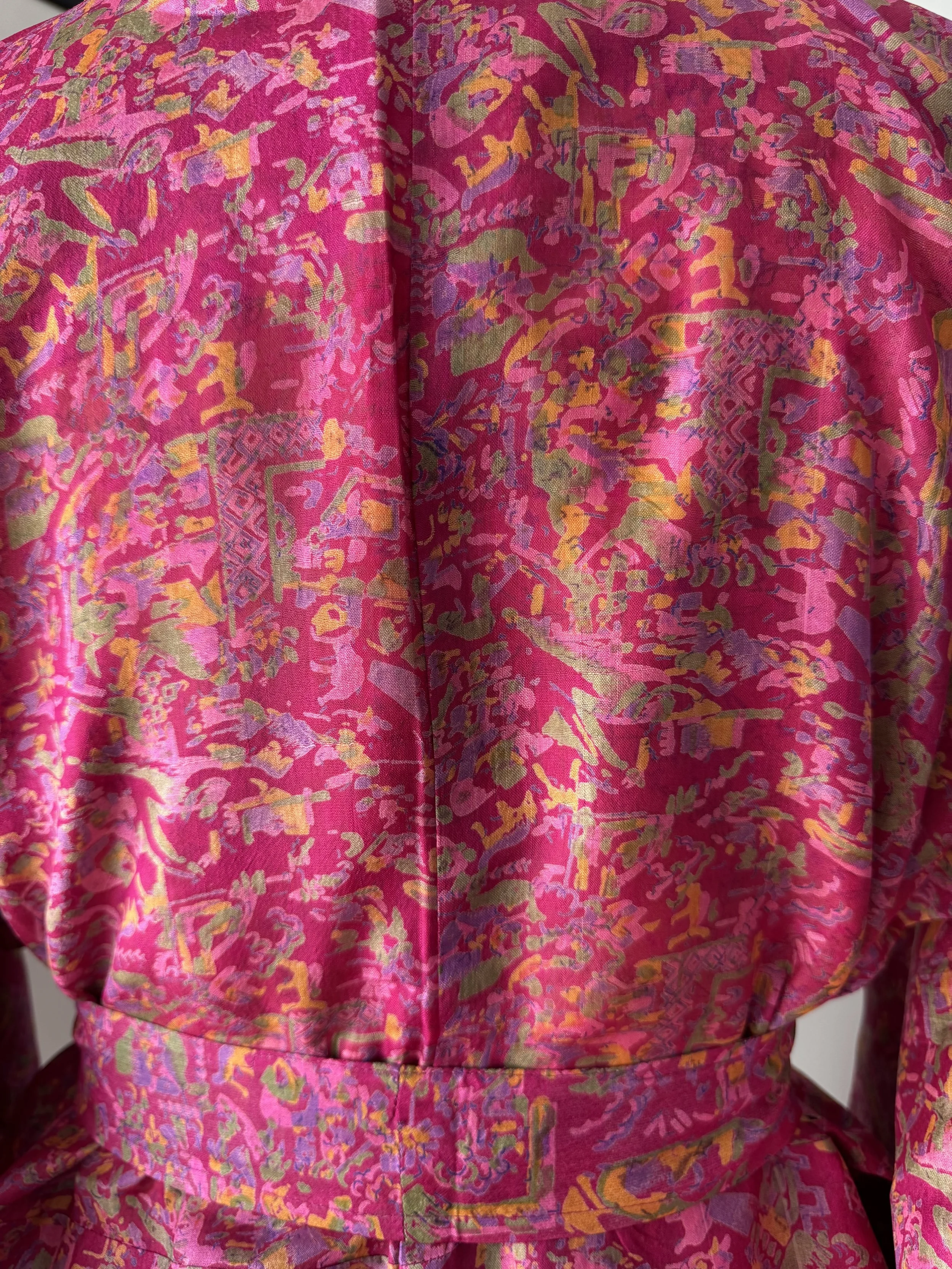 Back view of Rani pink upcycled sari silk kimono robe showing colourful floral pattern