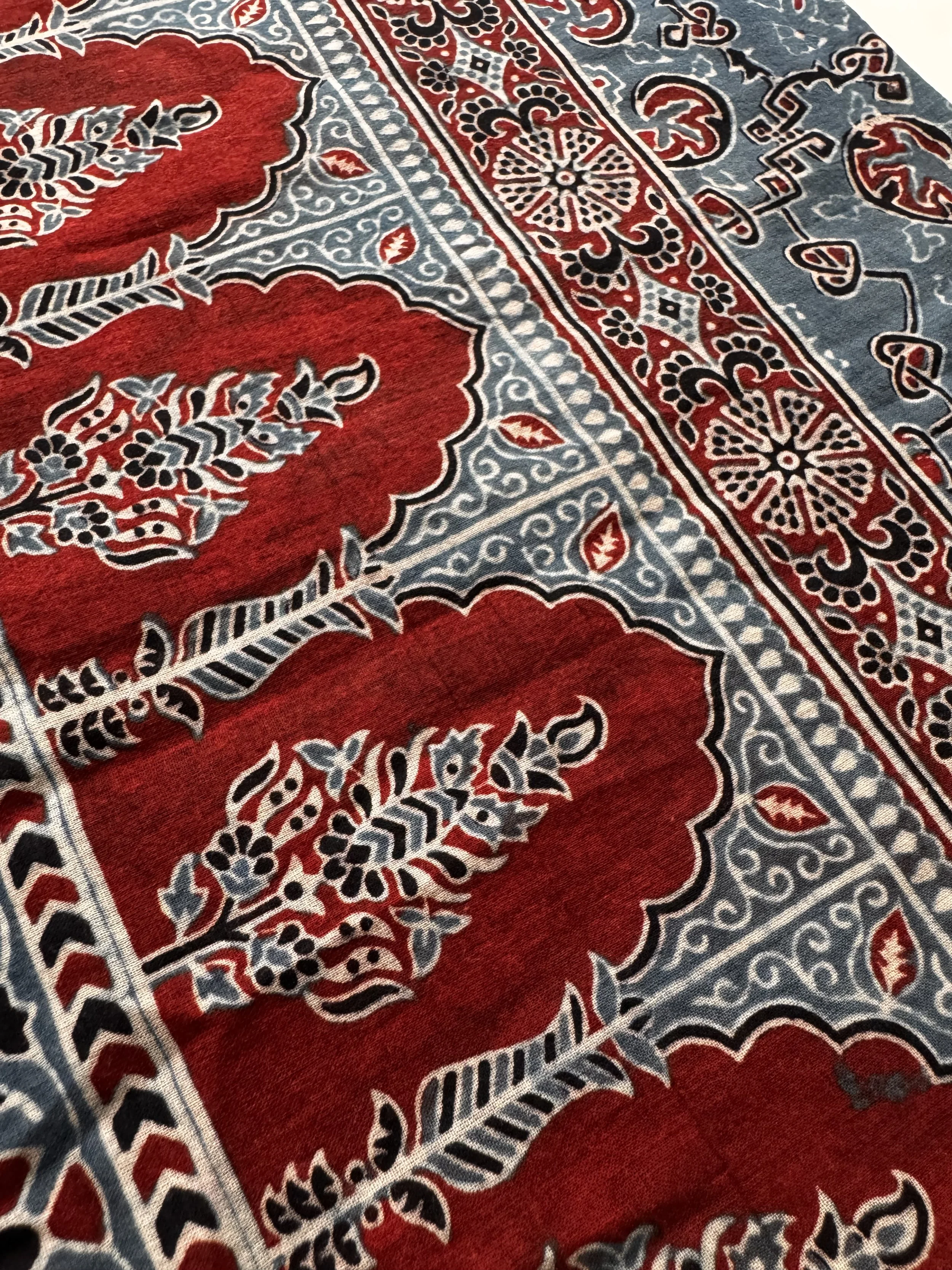 Strking geometric and floral Ajrakh print on red and indigo blue cotton scarf