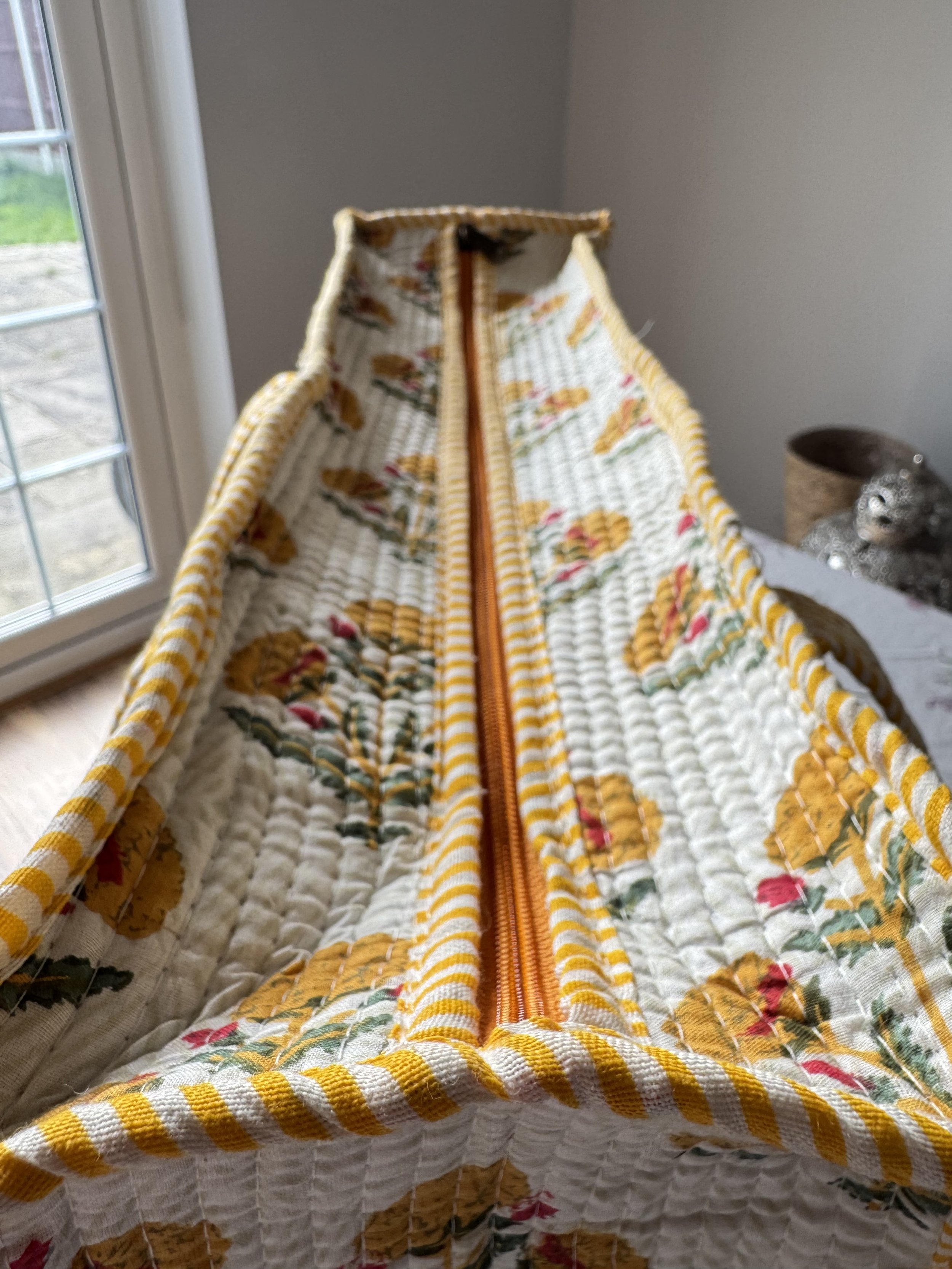 Zipper detail on floral print quilted cotton tote bag in yellow