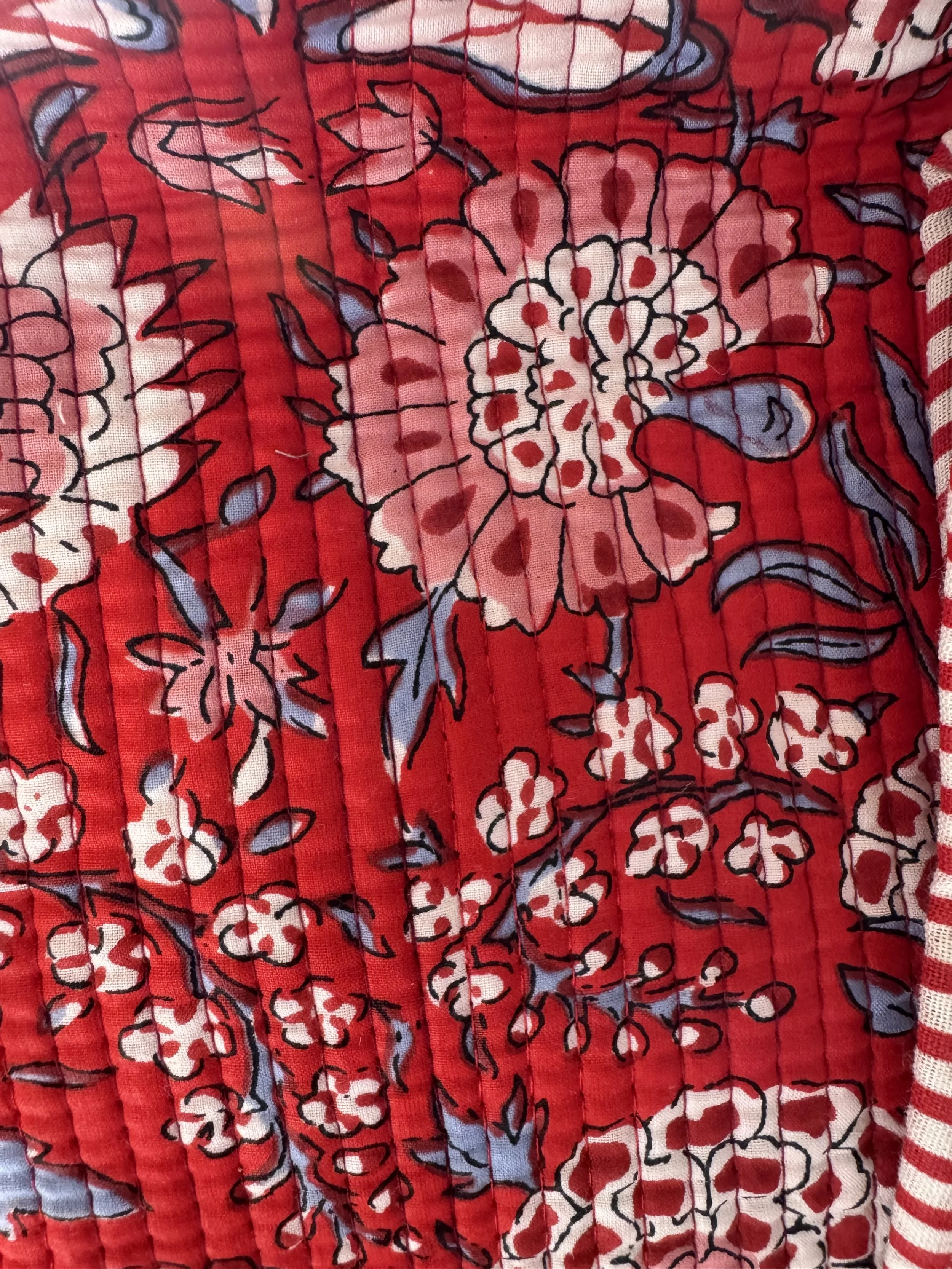 Close up of  floral design and on a quilted cotton tote shopper