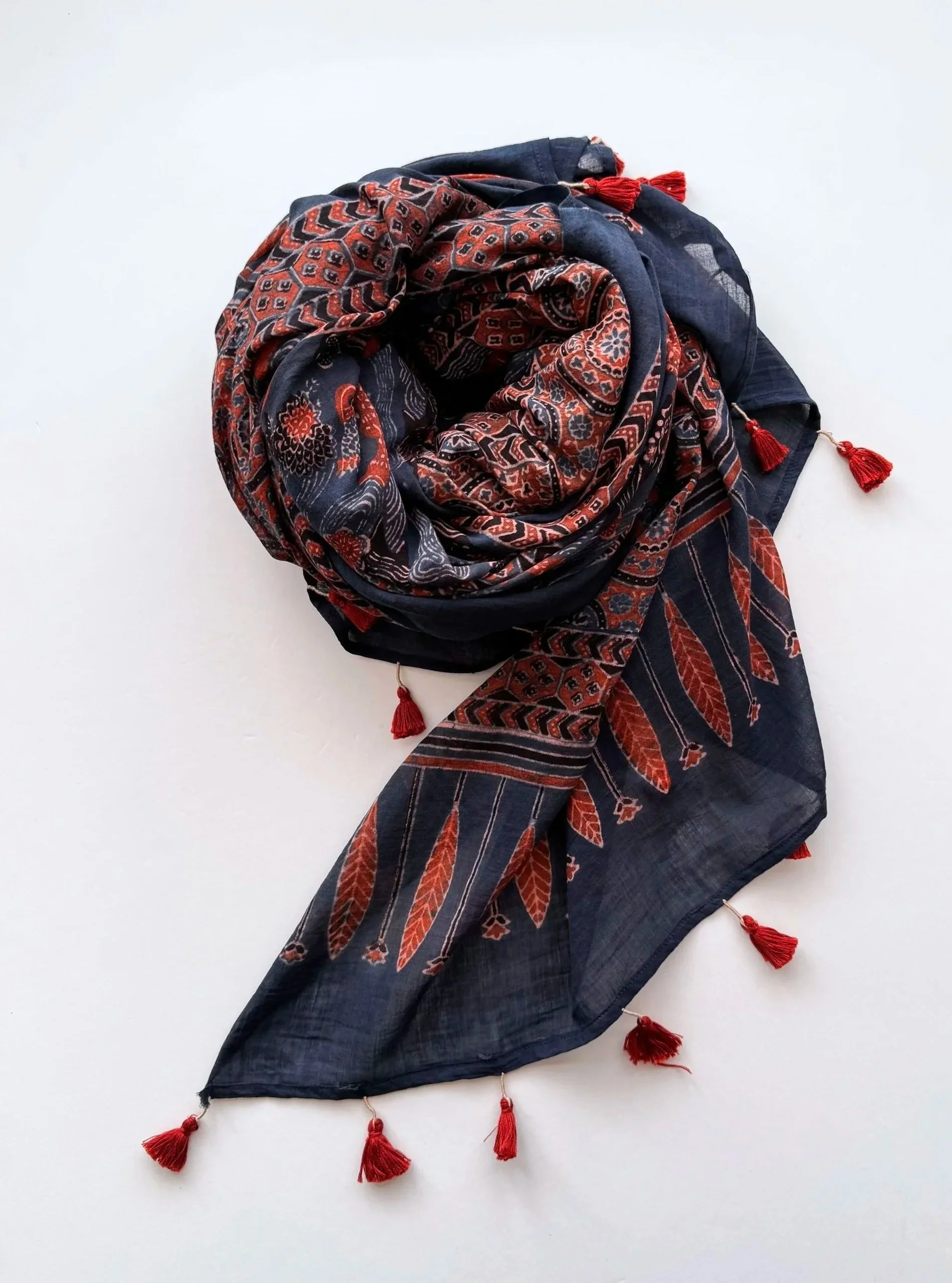 Oversized hand block printed Ajrakh shawl in indigo, rust red and black with tassels along the edges