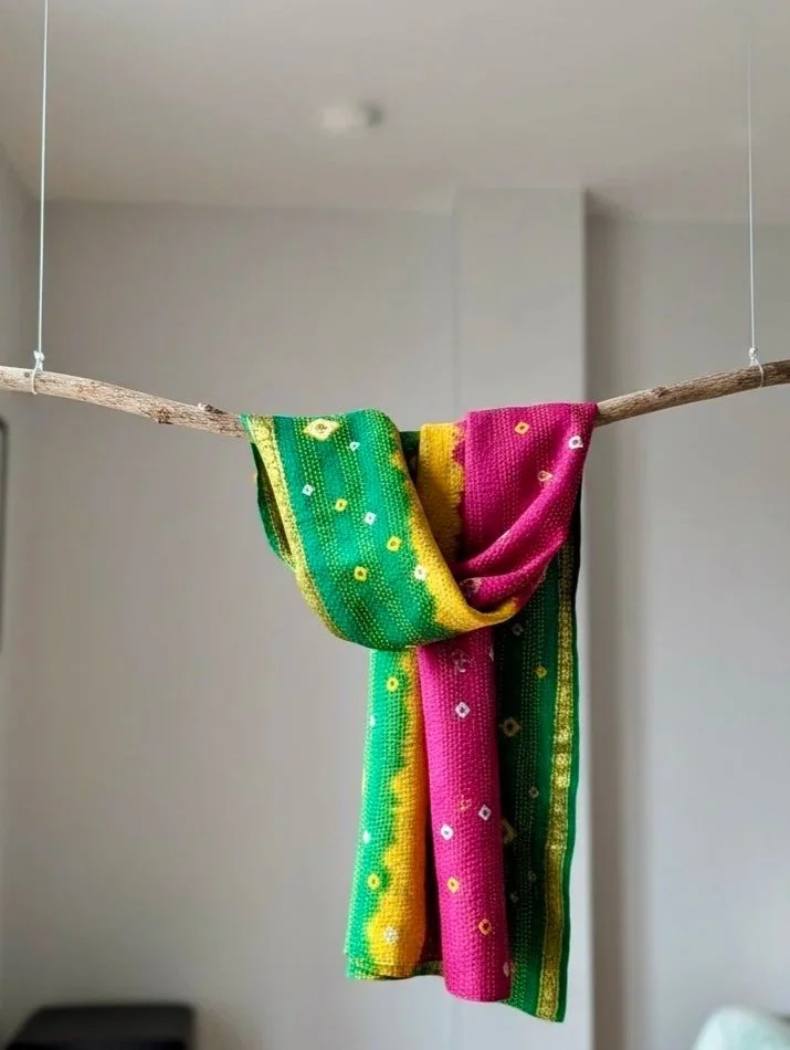 A colourful green yellow and pink summer Kantha scarf handmade from upcycled sari silk and hand embroidered with kantha stitch