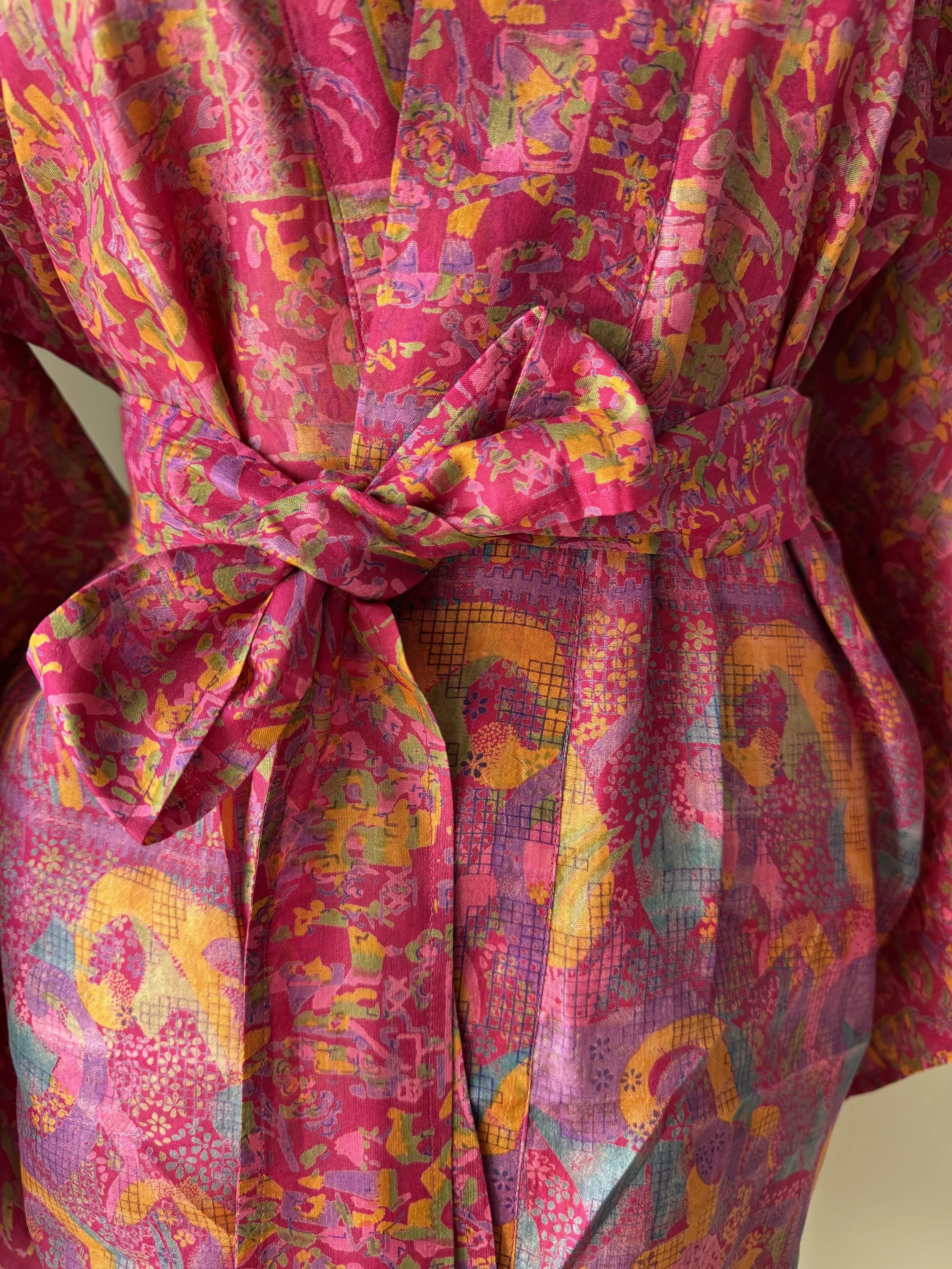 Matching silk tie belt on Rani pink upcycled sari silk kimono robe, handmade by artisans in India