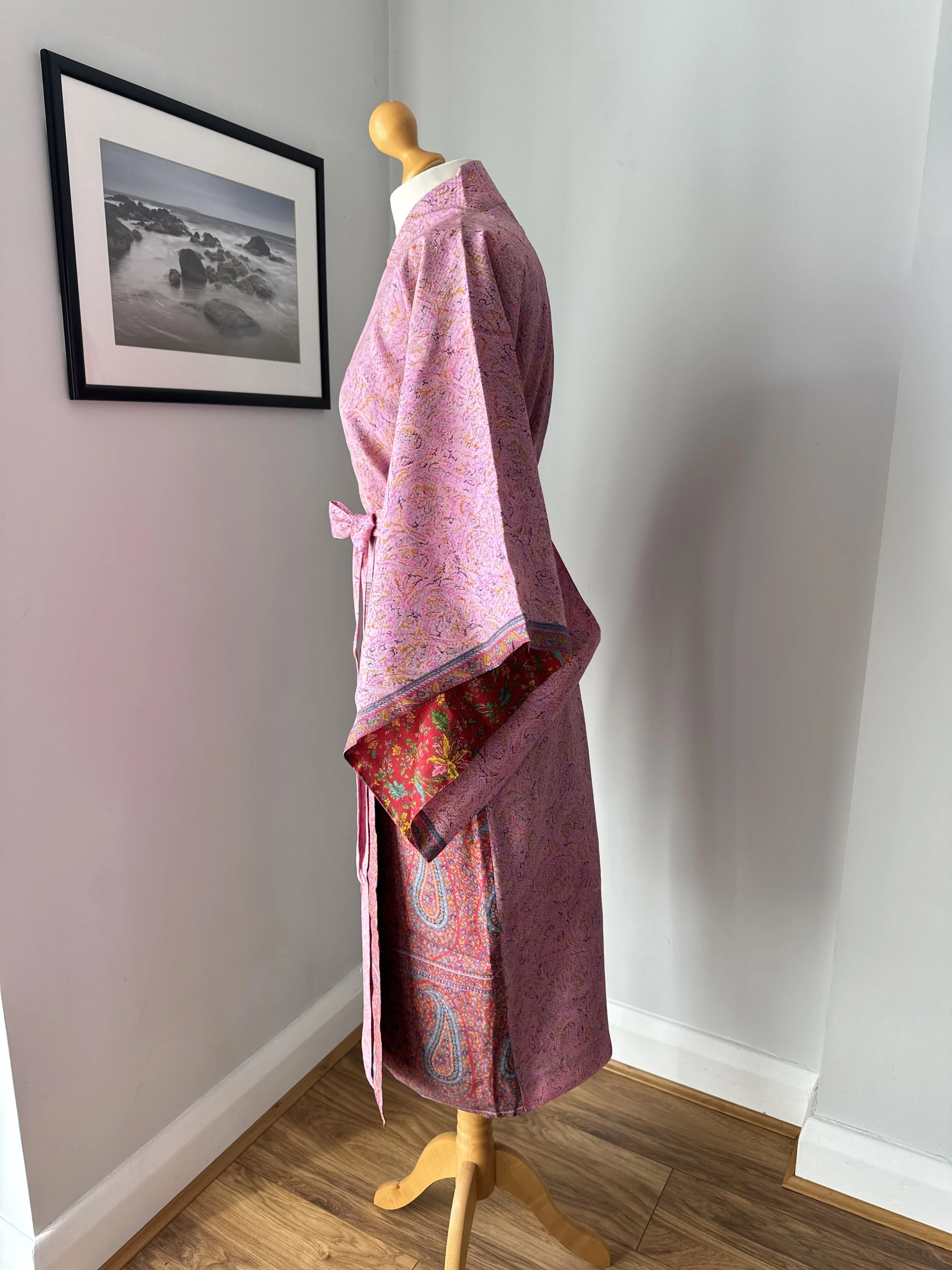 Side view of silk sari kimono robe with flowing kimono sleeves, wrapover front and contrasting lining