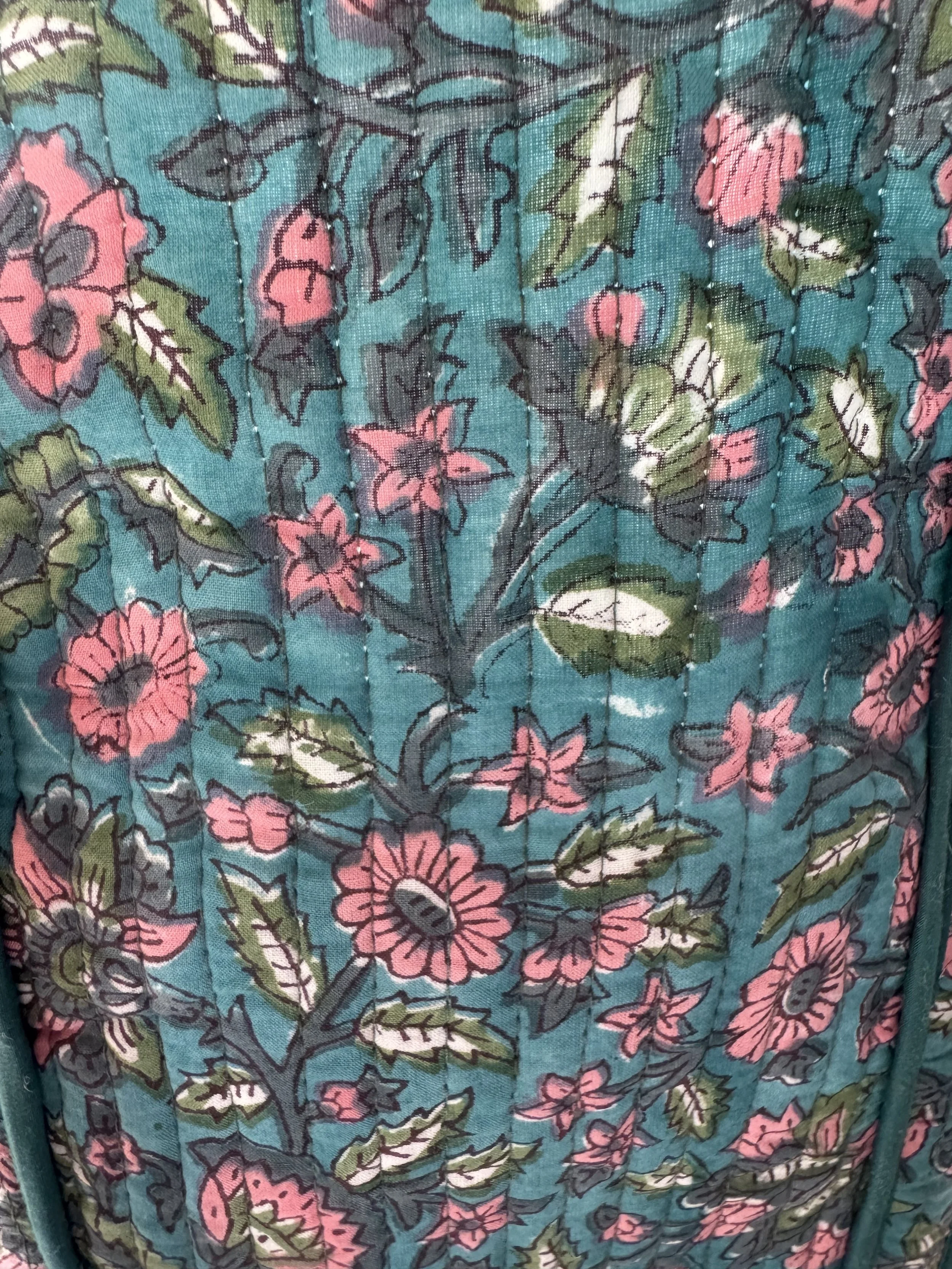 Floral indian hand block printed design on a quilted blue tote bag