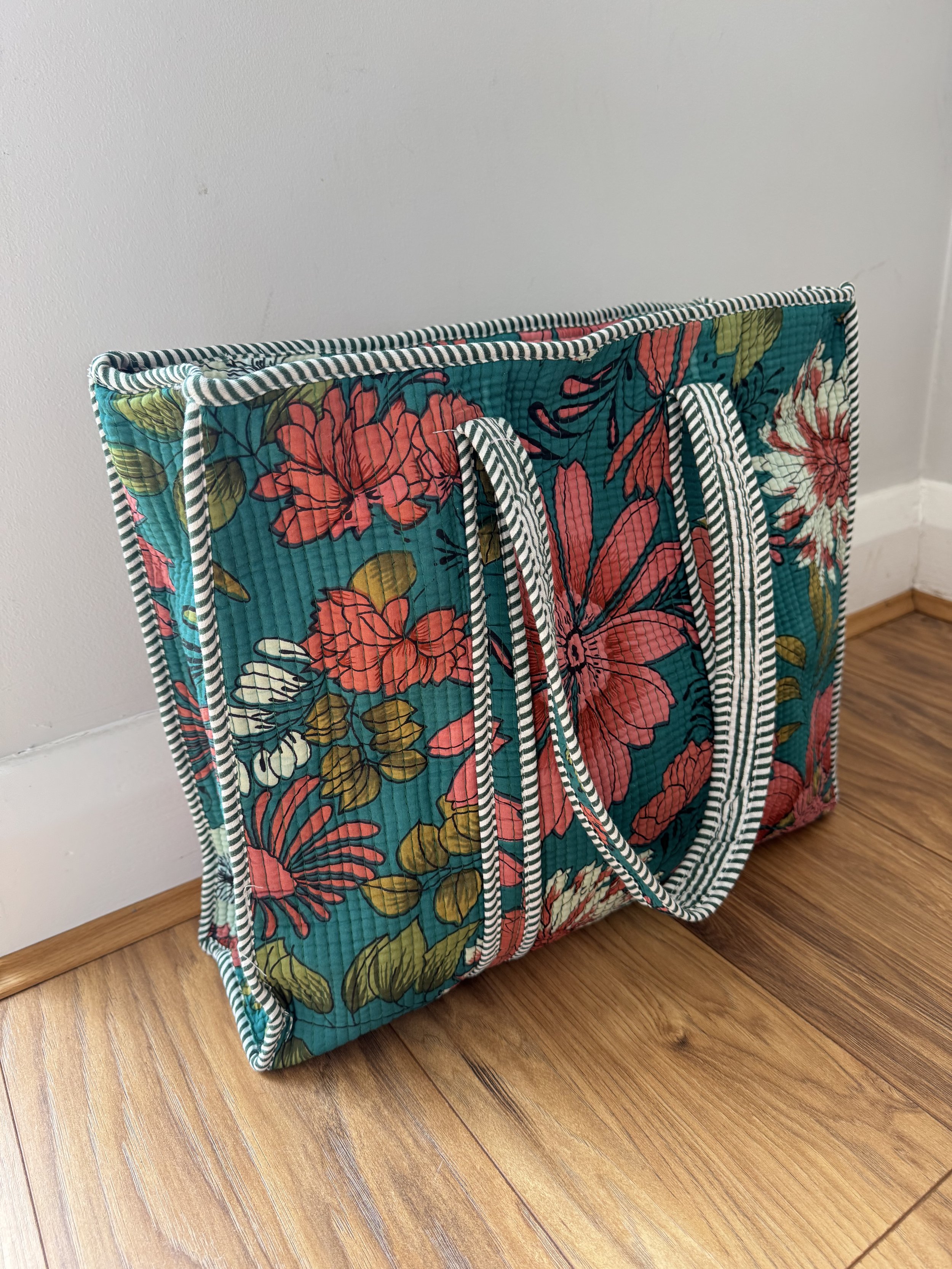 Handmade quilted cotton tote shopper bag in teal with blooming floral print