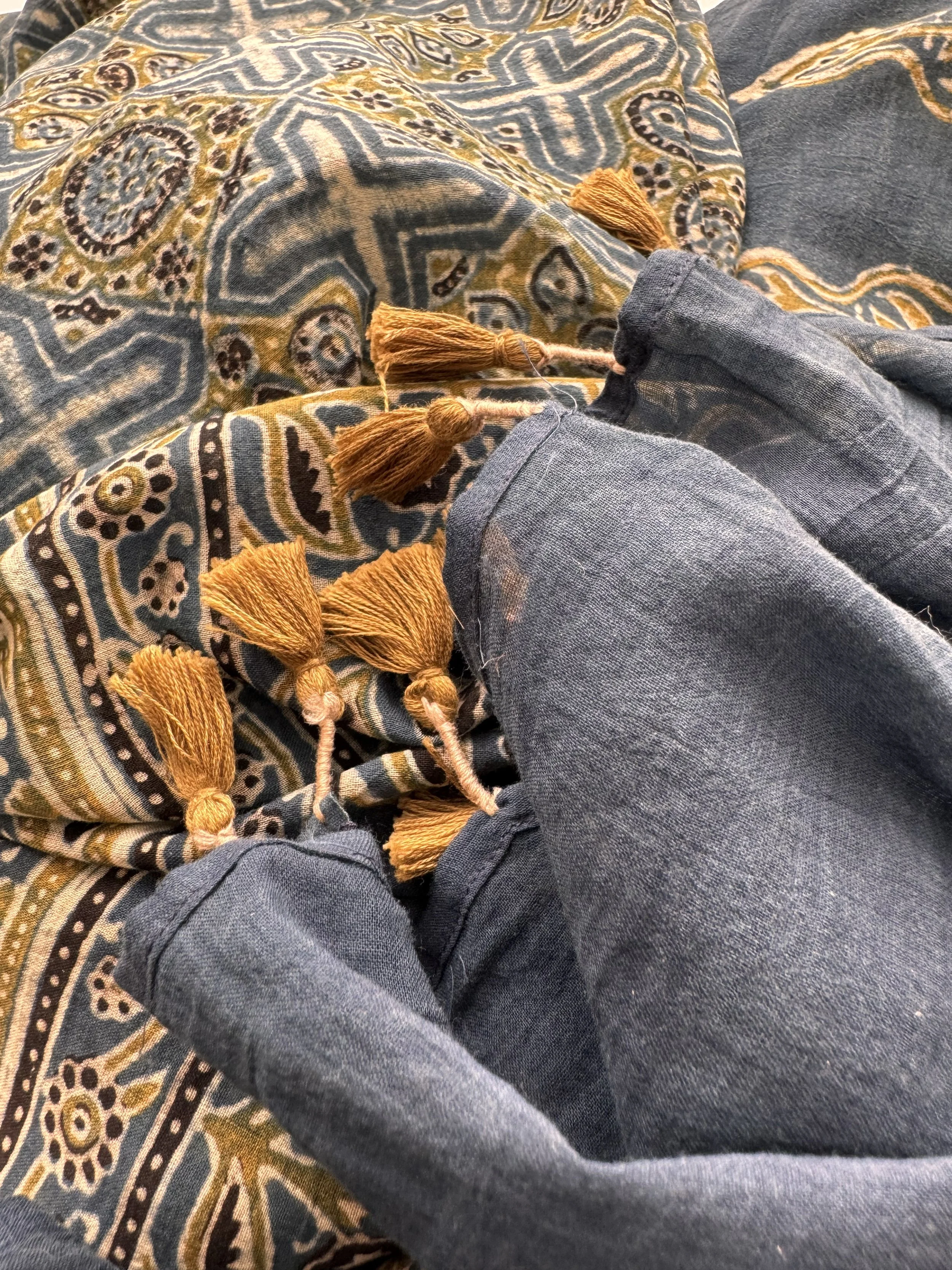 indigo and olive Ajrakh scarf showing the tassel edge and intricate block printed border