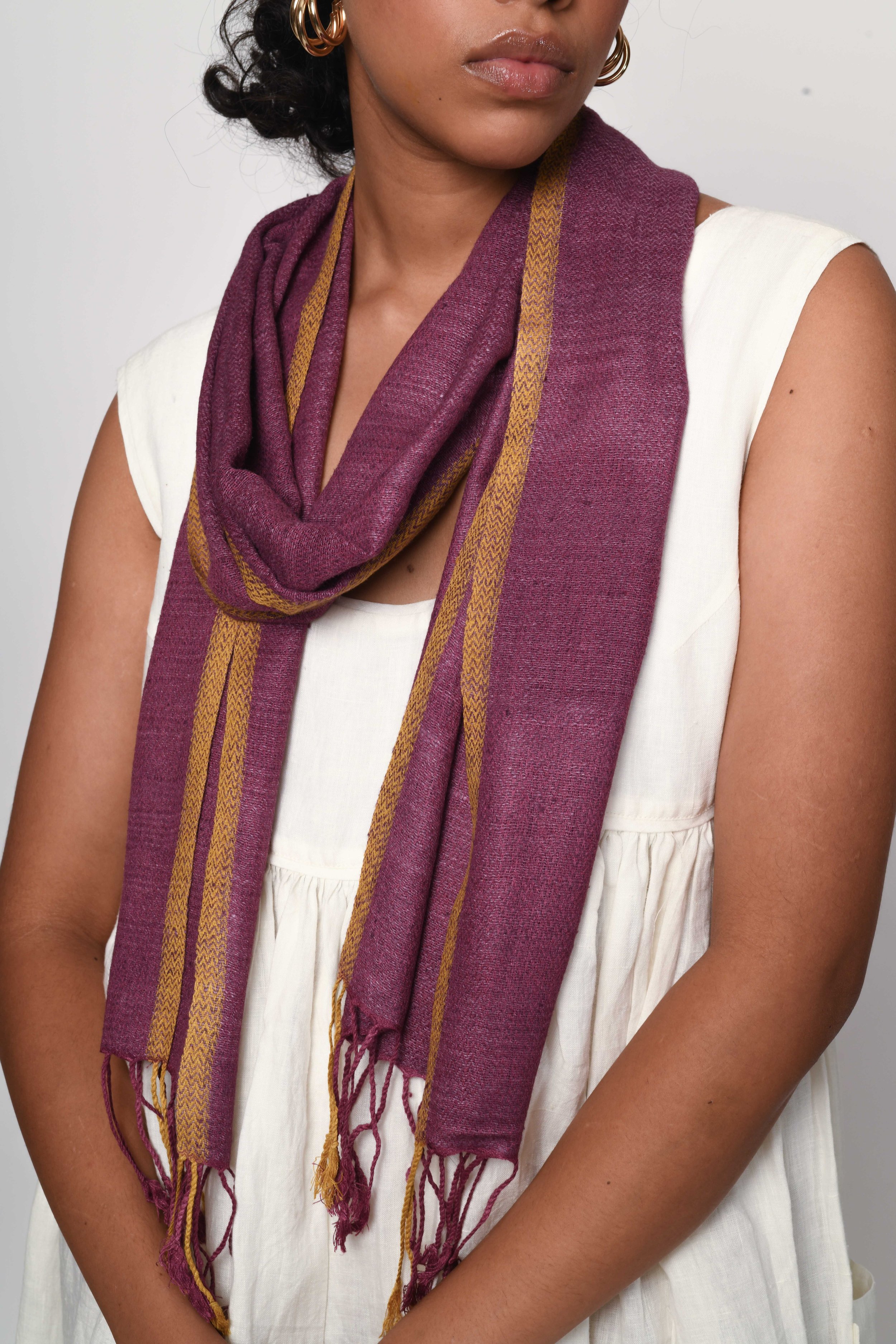 Model wearing lightweight ladies purple Eri silk scarf with contrast trim