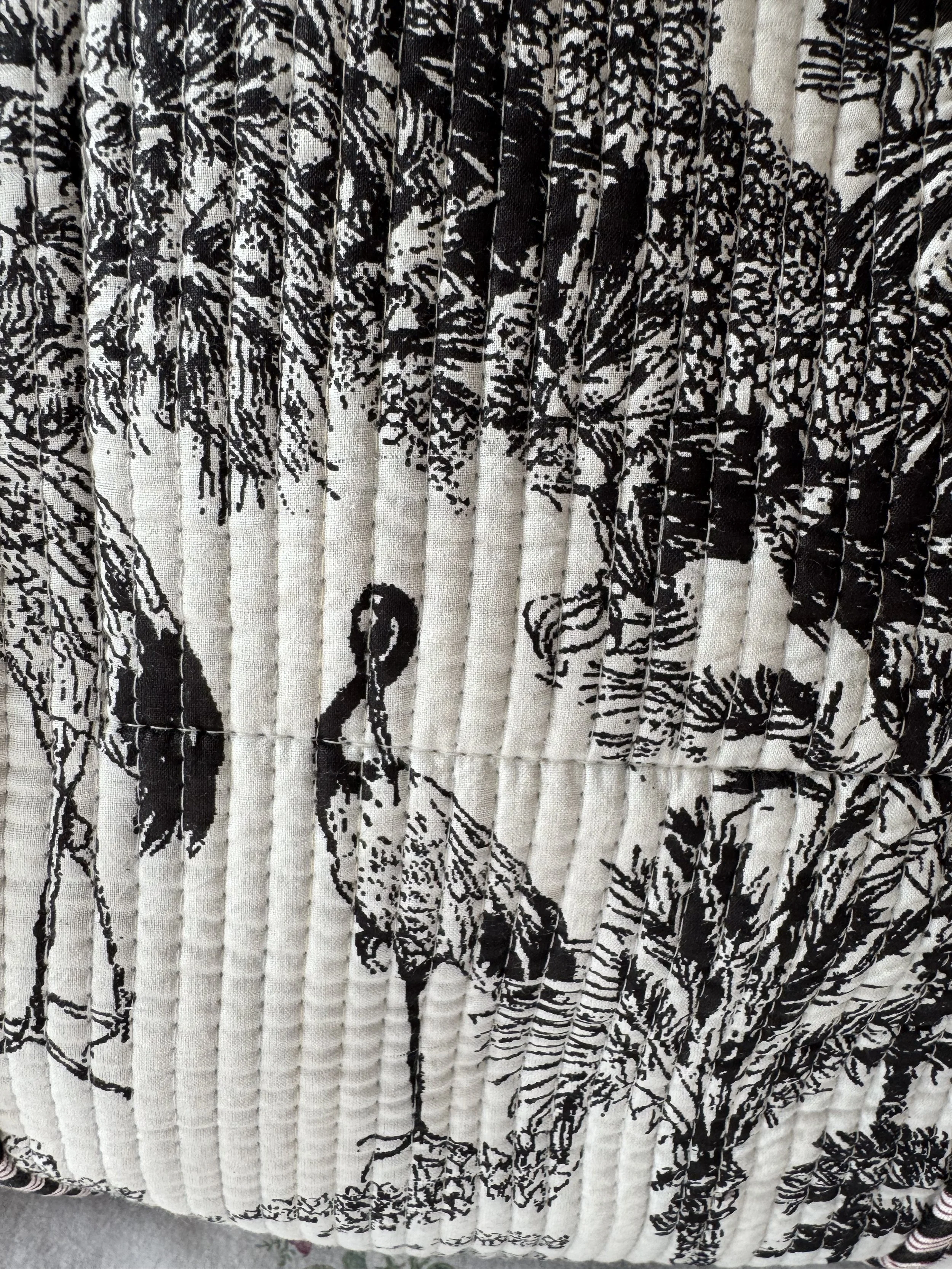 Exotic bird images screen printed in Toile de Jouy style on black and white quilted cotton tote bag