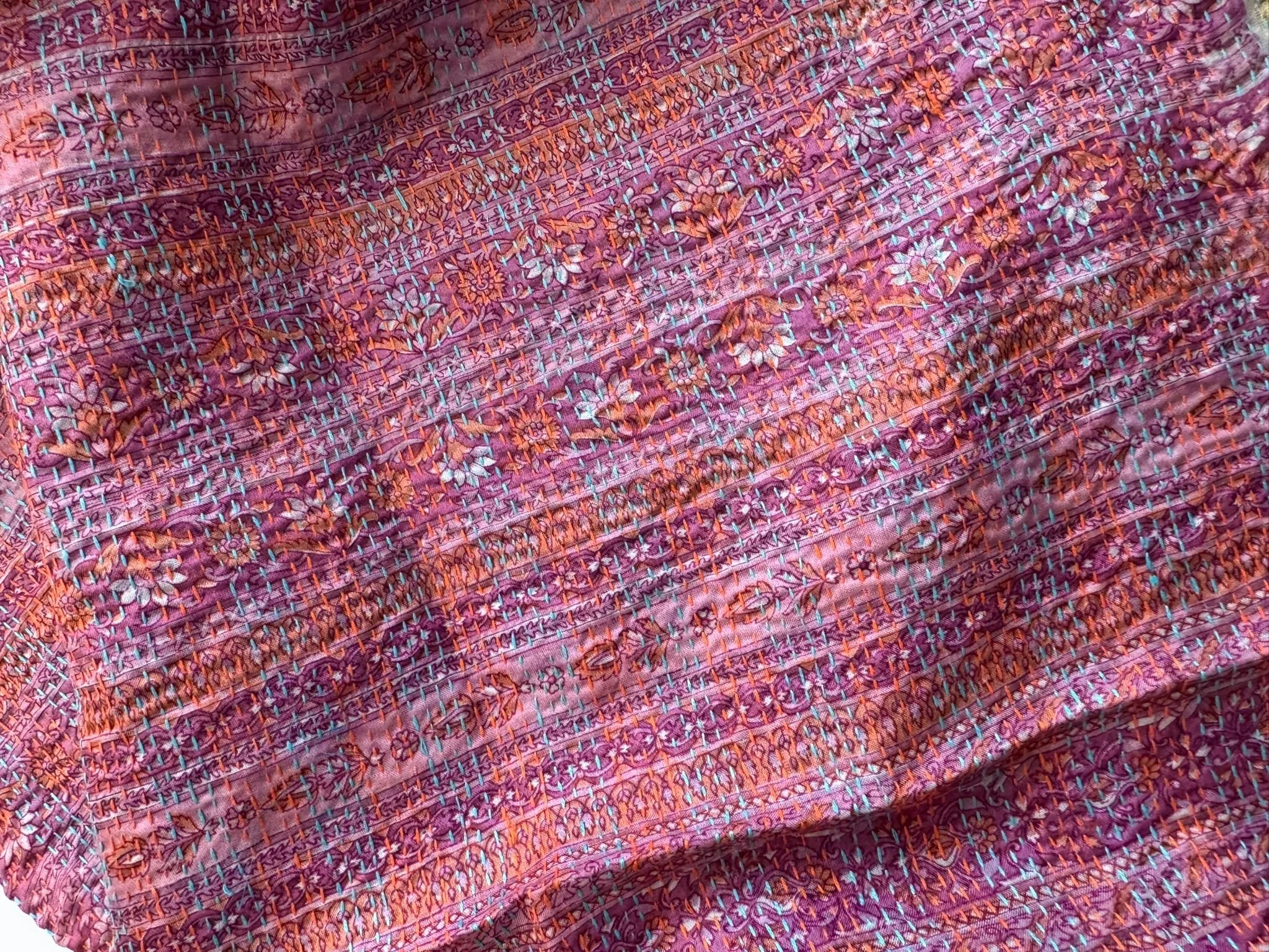 Floral pink sari silk fabric quilted with running kantha stitch