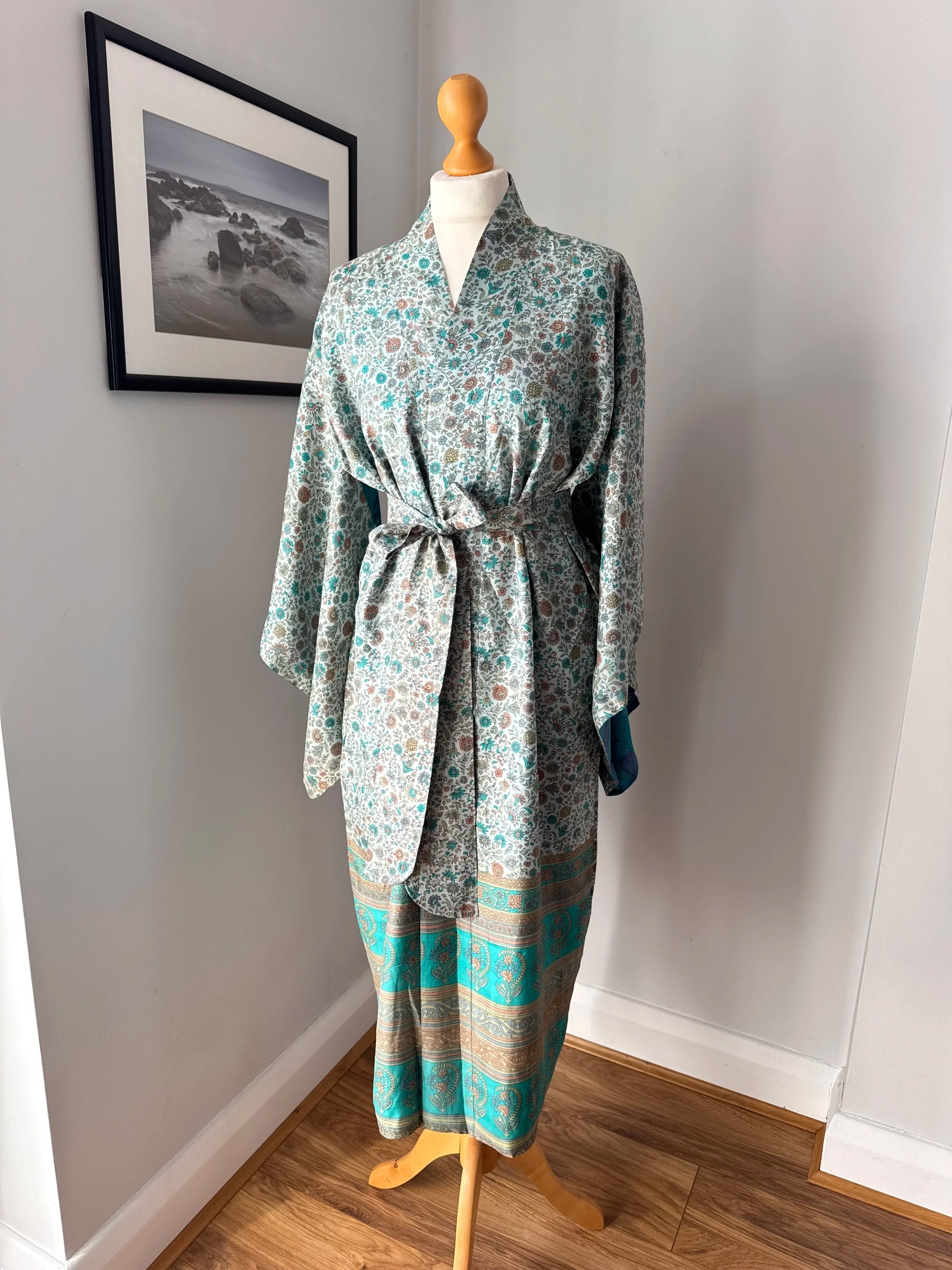 Recycled sari silk kimono dressing gown with blue and cinnamon floral print and rich paisley border styled on a mannequin