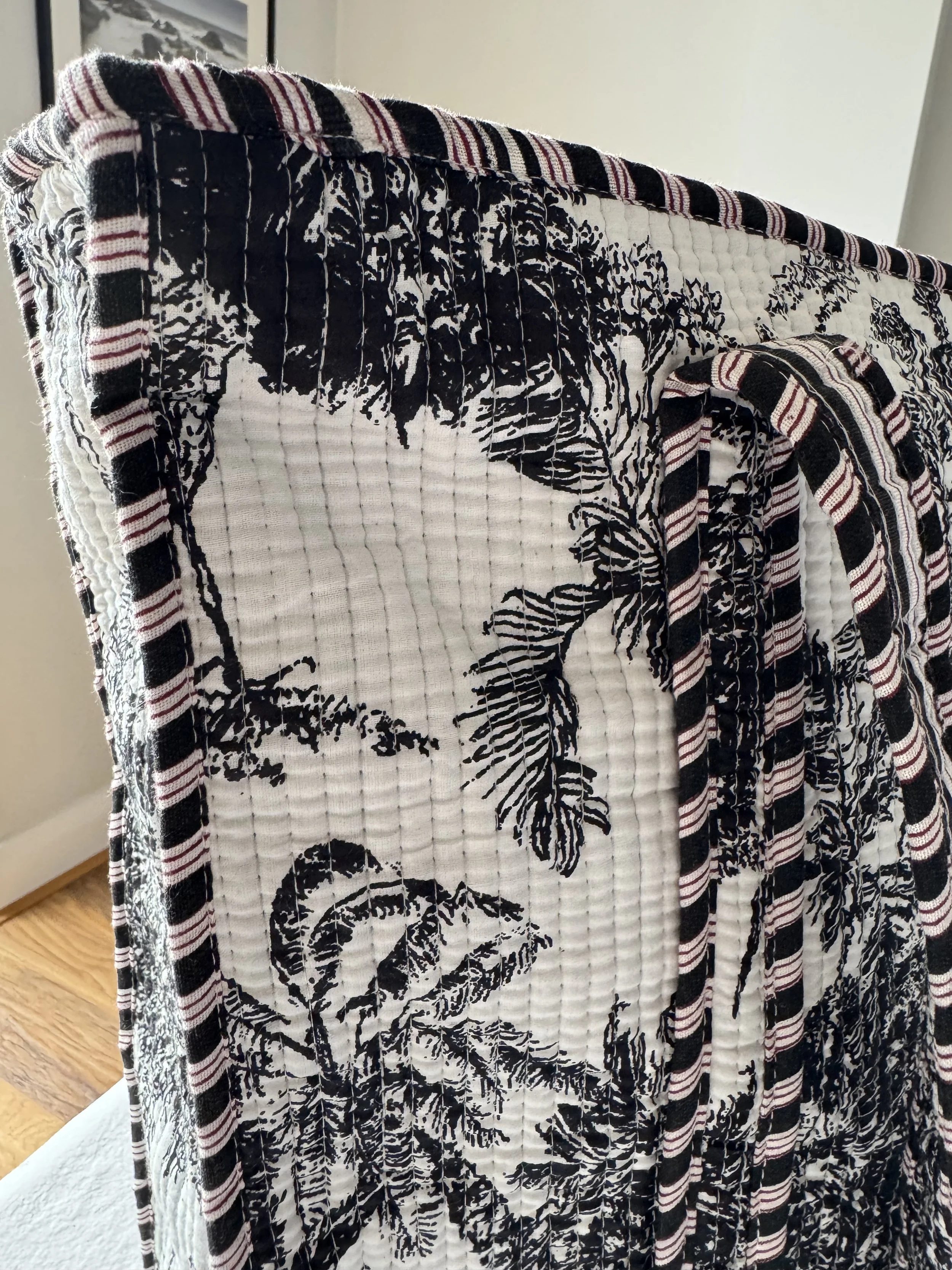 Close up of black and white toile de jouy jungle botanical print on handmade quilted cotton tote bag by Jewelled Buddha