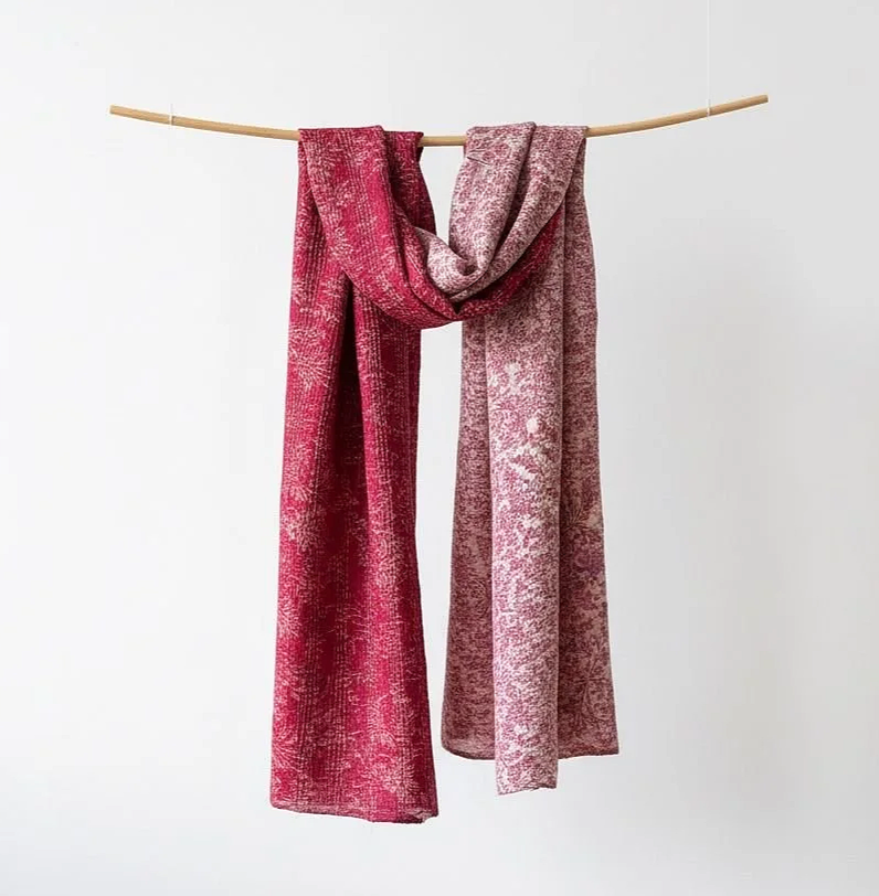 A colourful pink floral summer scarf handmade from upcycled sari silk and hand embroidered with kantha stitch