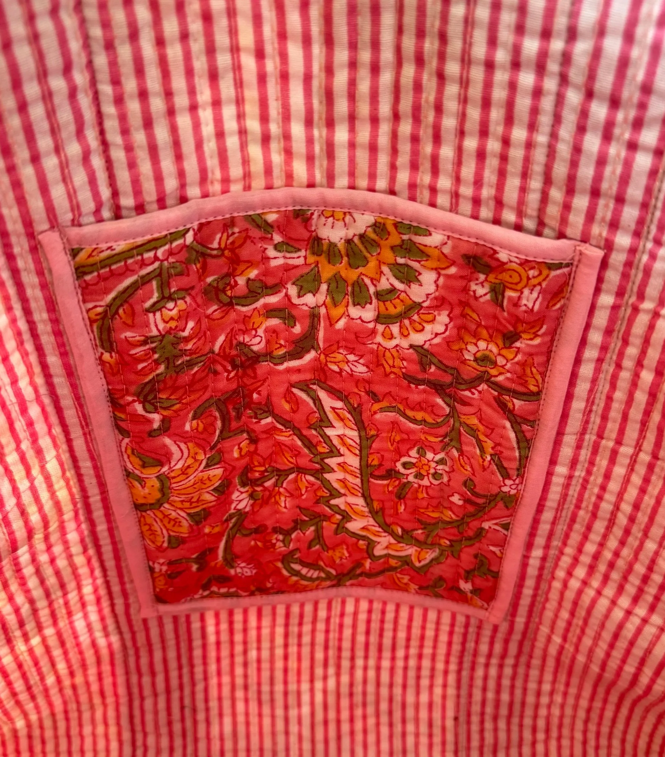 Close up inside pocket of striped quilted cotton tote bag