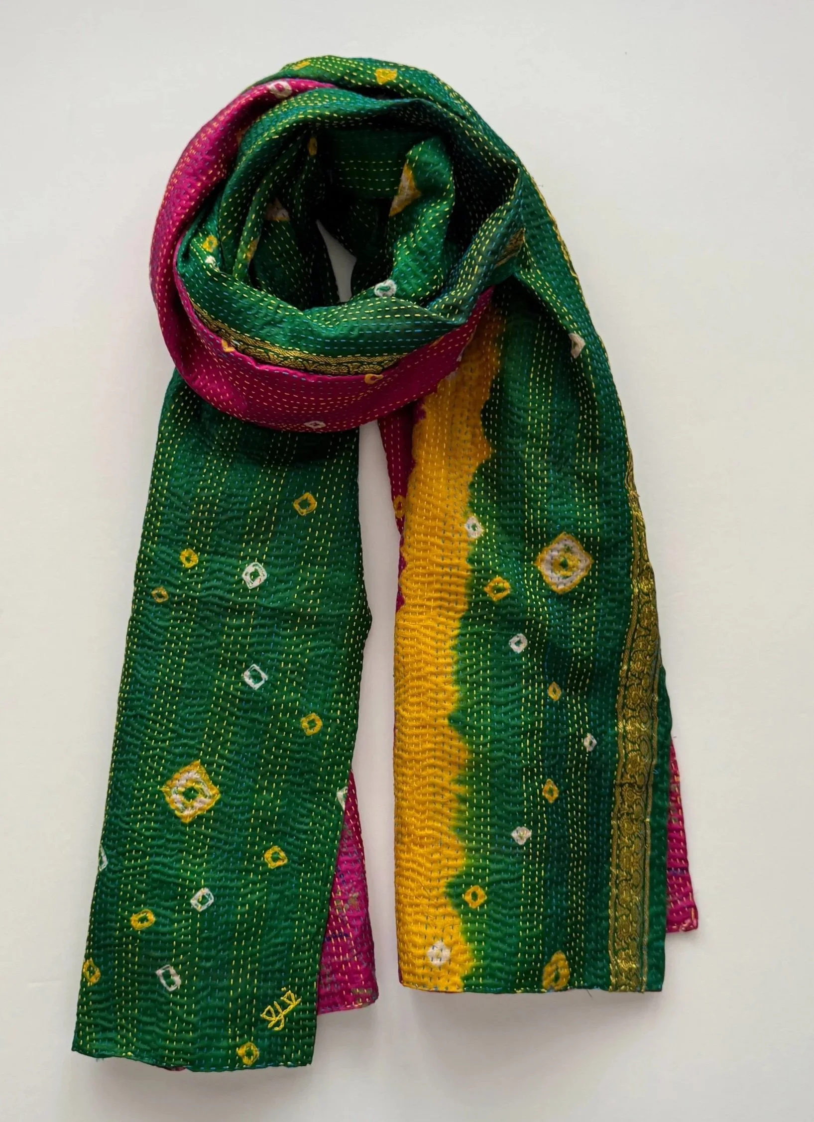 Bold and bright Bandhini tie dye silk scarf in green, yellow and pink, made from upcycled sari silk and hand embroidered with Kantha stitch.