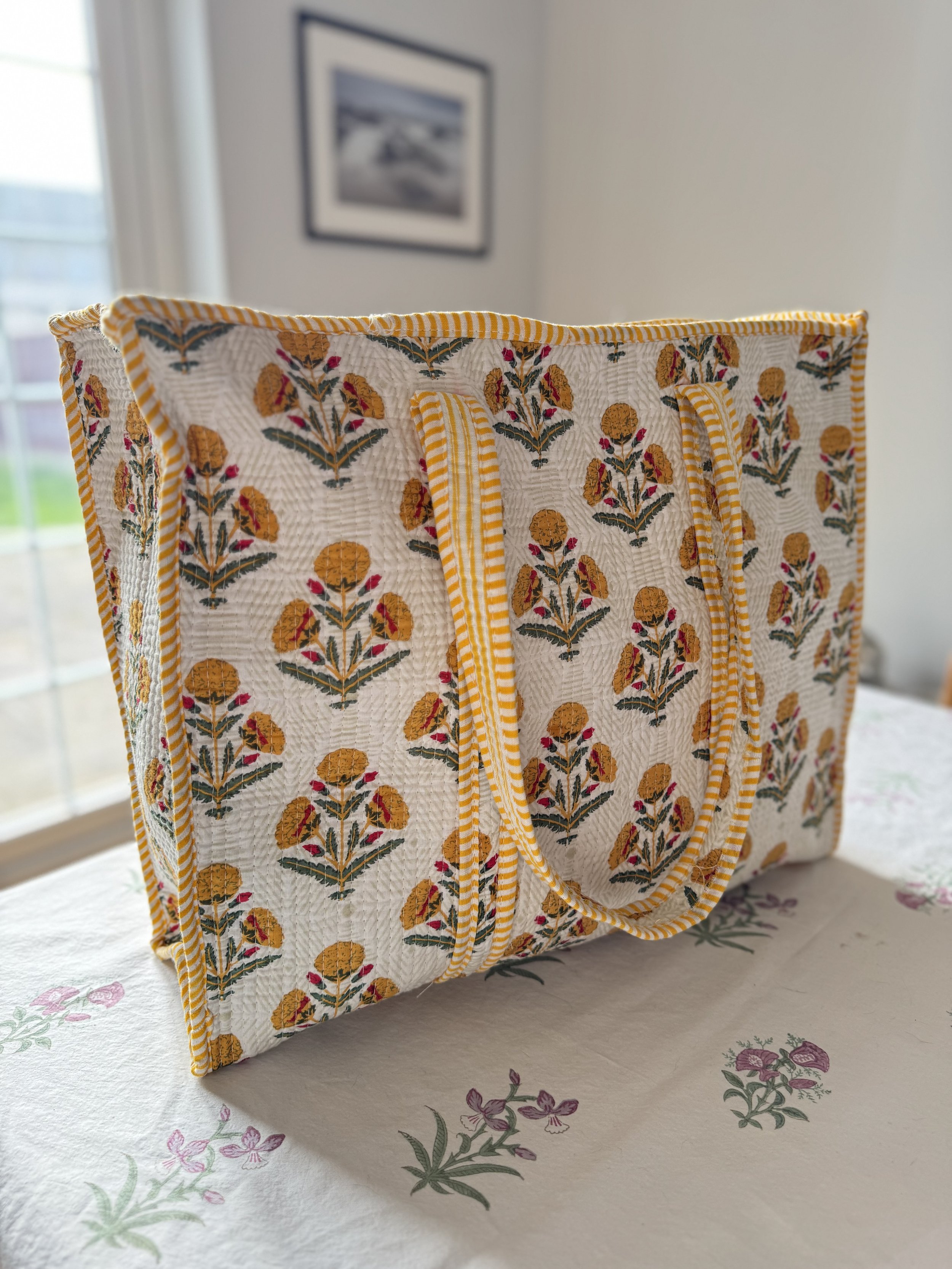 Floral print quilted cotton screen print tote bag in yellow with contrasting striped shoulder straps and trims