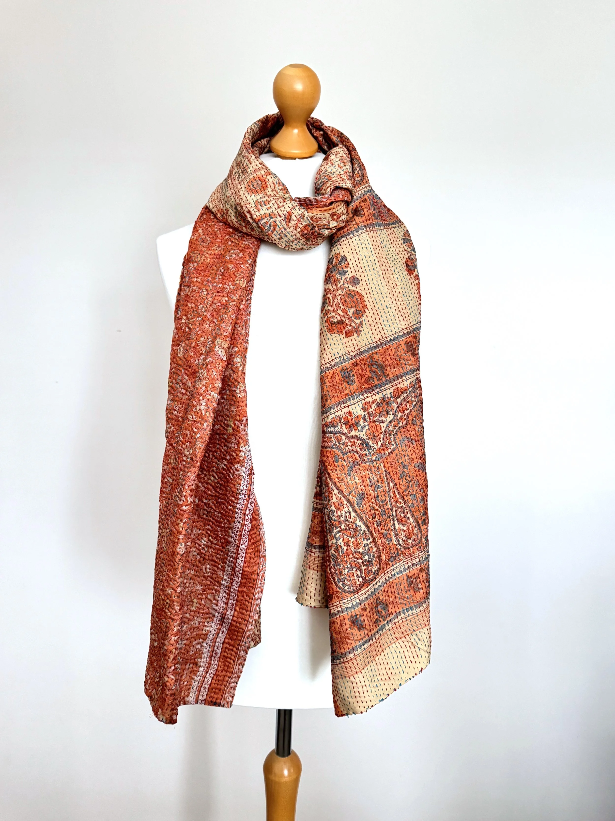 Long floral print recycled sari kantha scarf hand embroidered with kantha stitch in orange and beige.