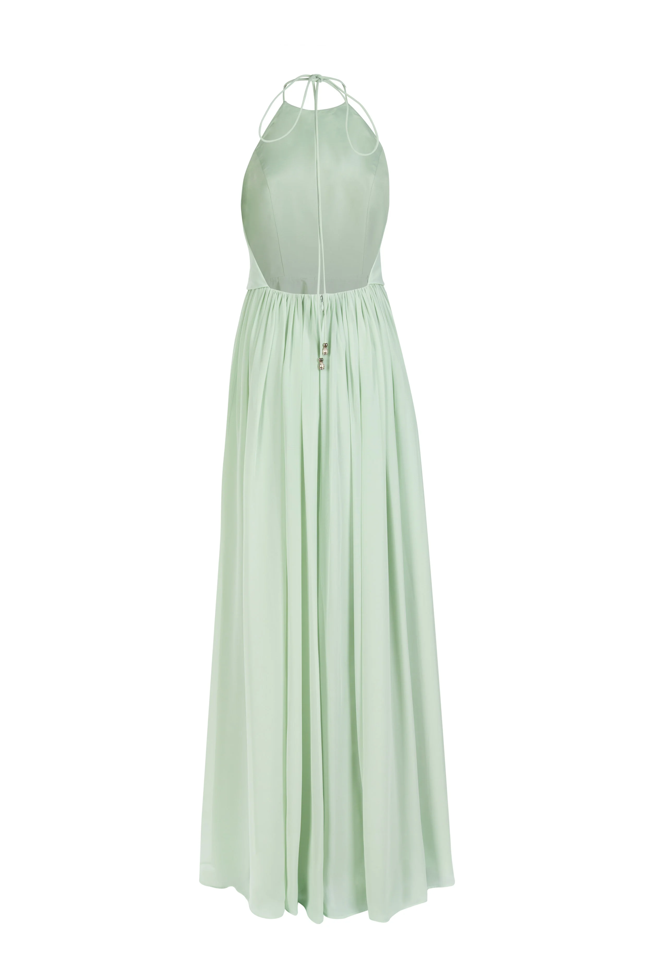 Cut-out image of the pale green evening dress showing the open back and delicate ties.